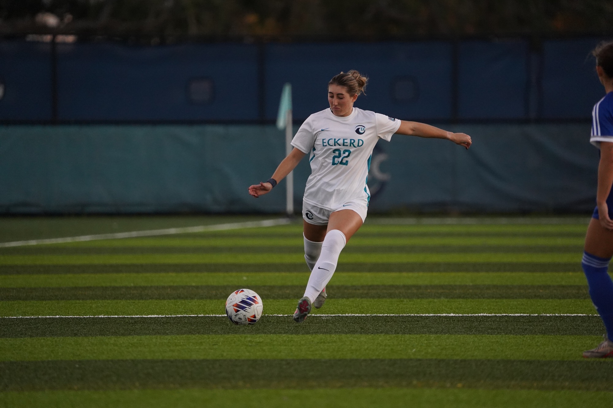 Player dribbles ball up field