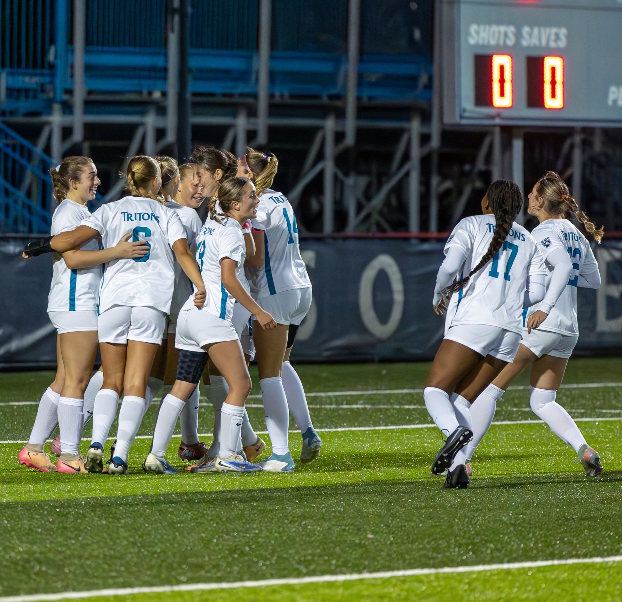 Players celebrate after goal