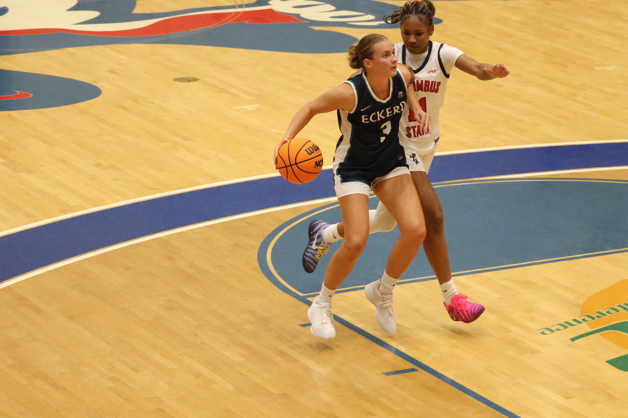 Player drives past defender