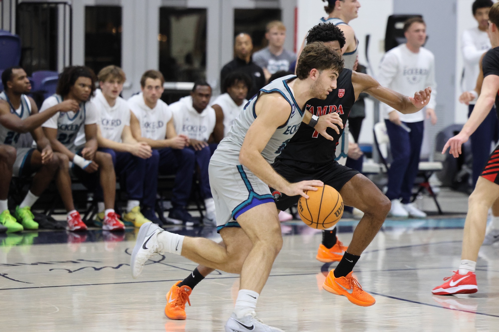 Player drives past defender