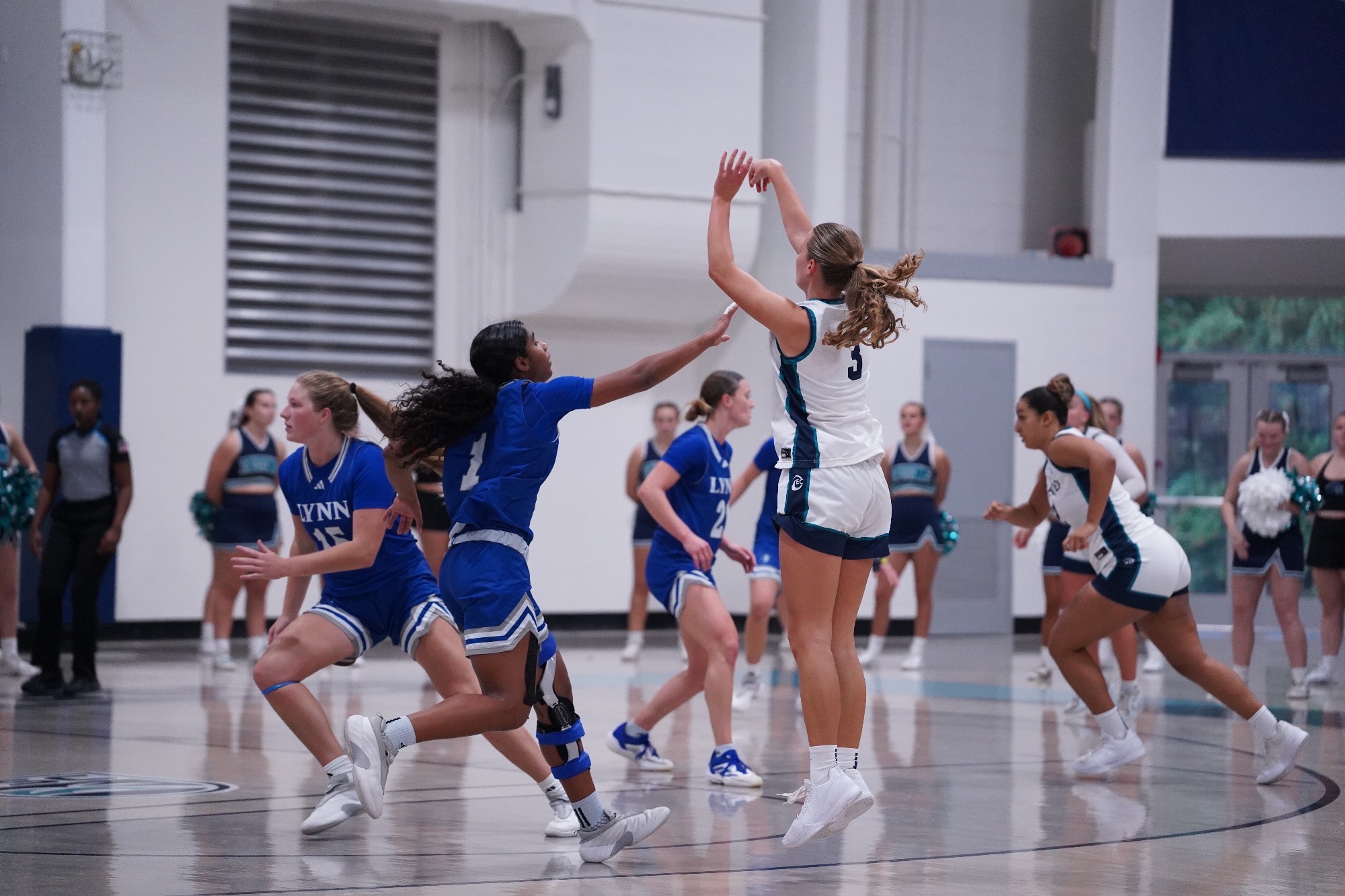 Player shooting a three-pointer
