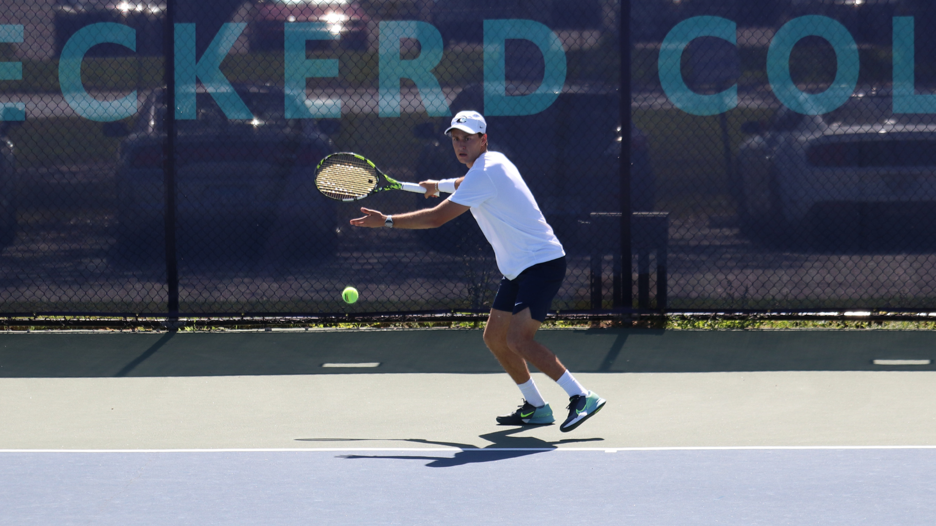 Batu Ataseven hitting a tennis ball