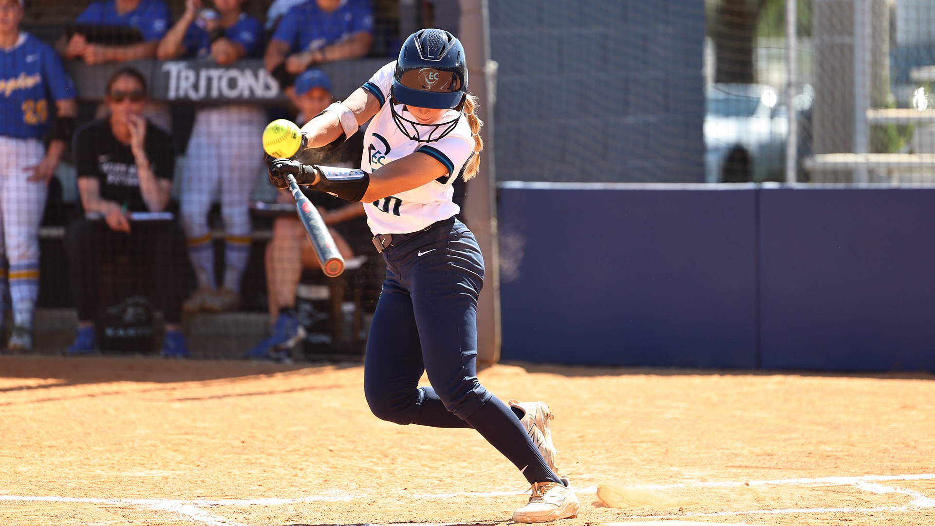 softball player slapping ball 