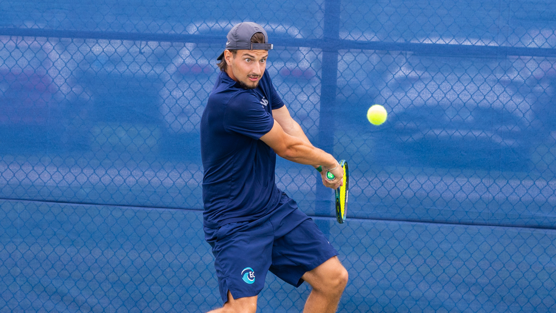 Gheorghe hits a forehand