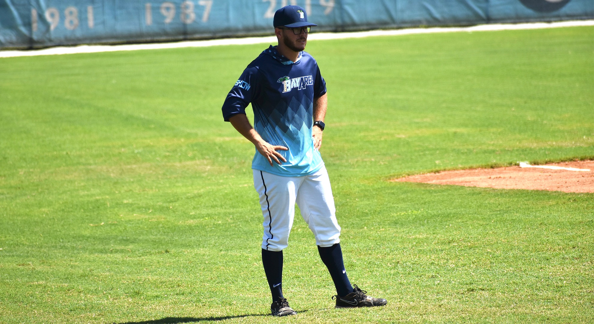 baseball coach at third base standing in-game 