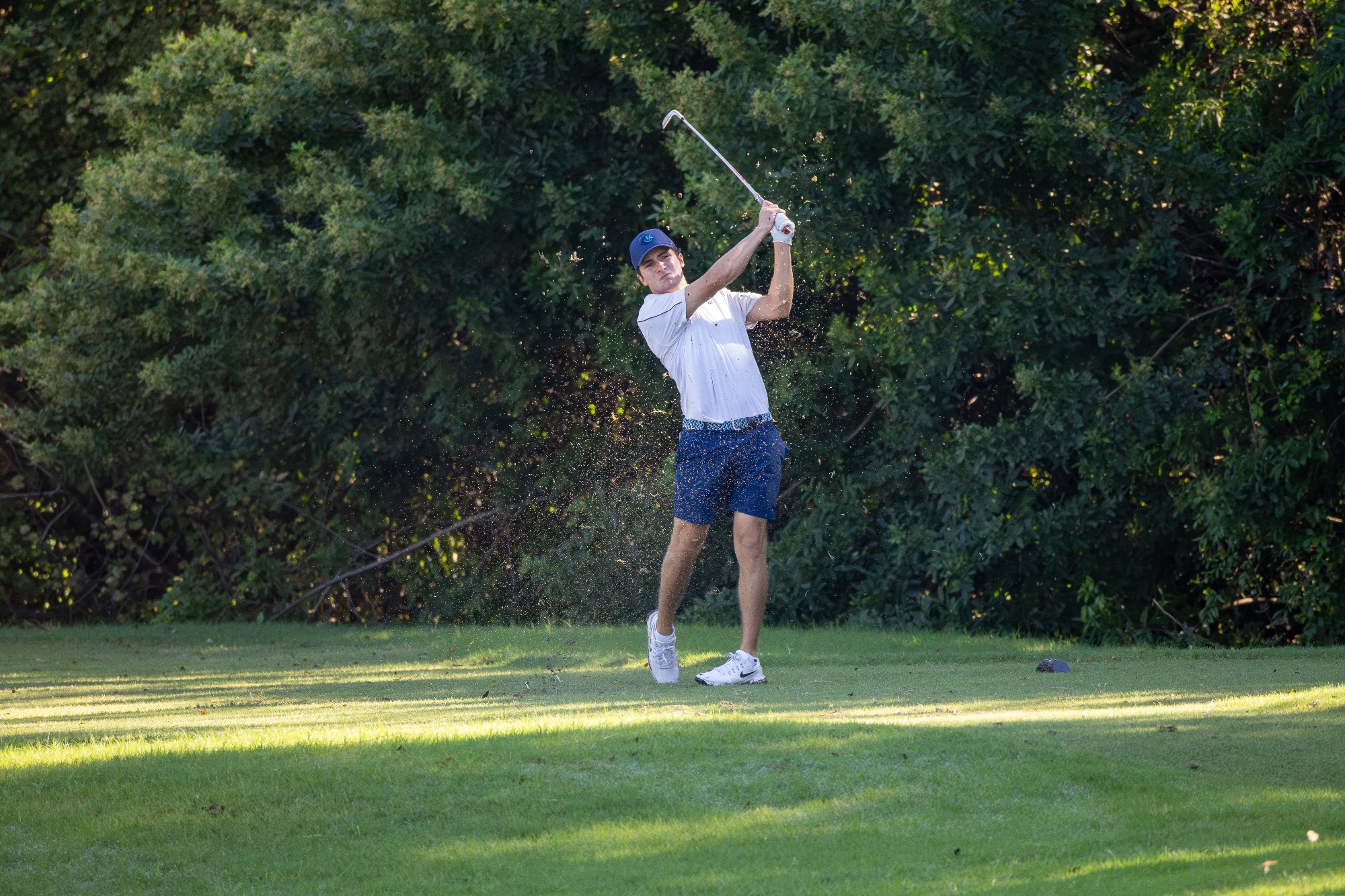 player swinging golf club