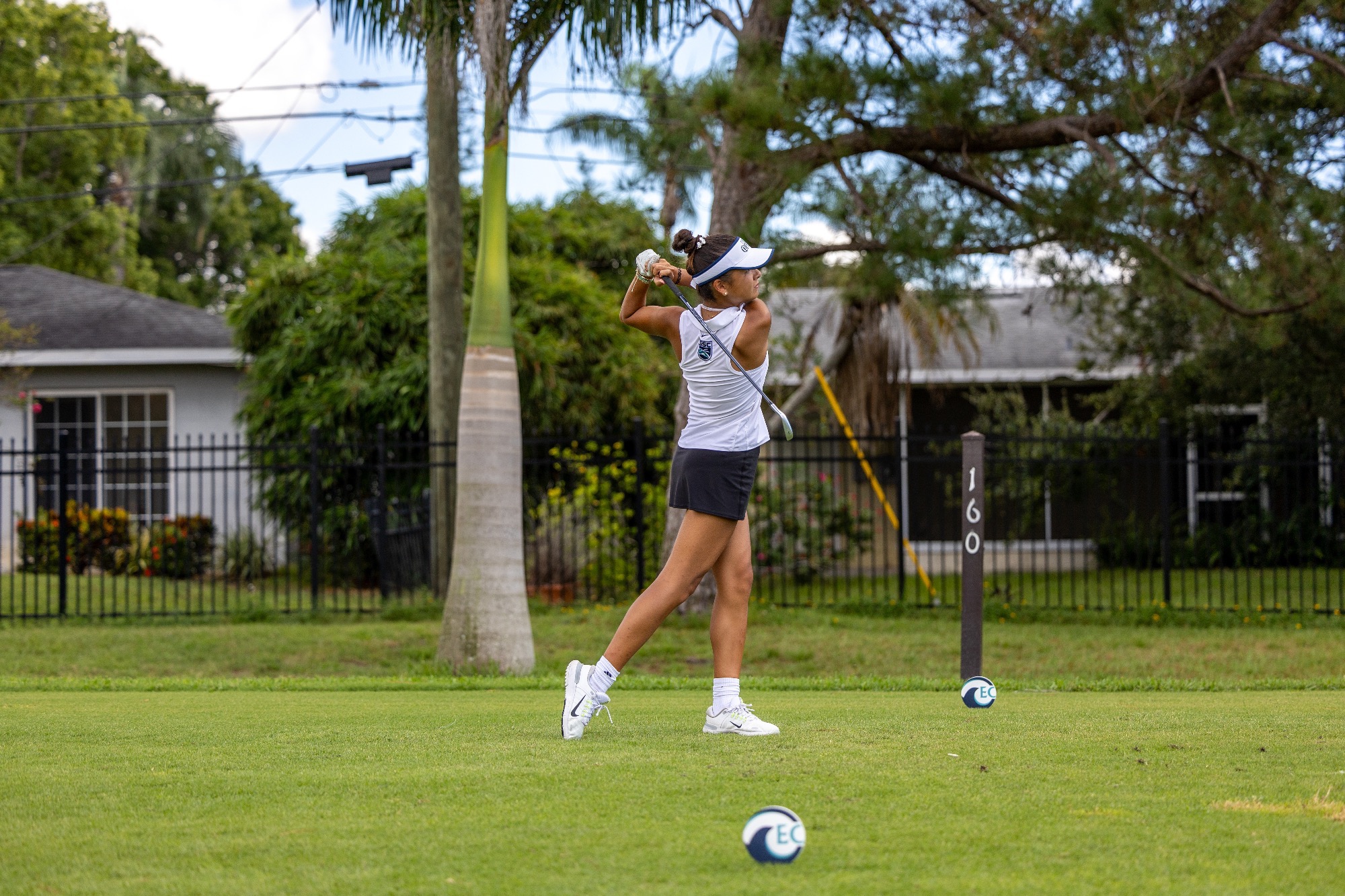 player swings club