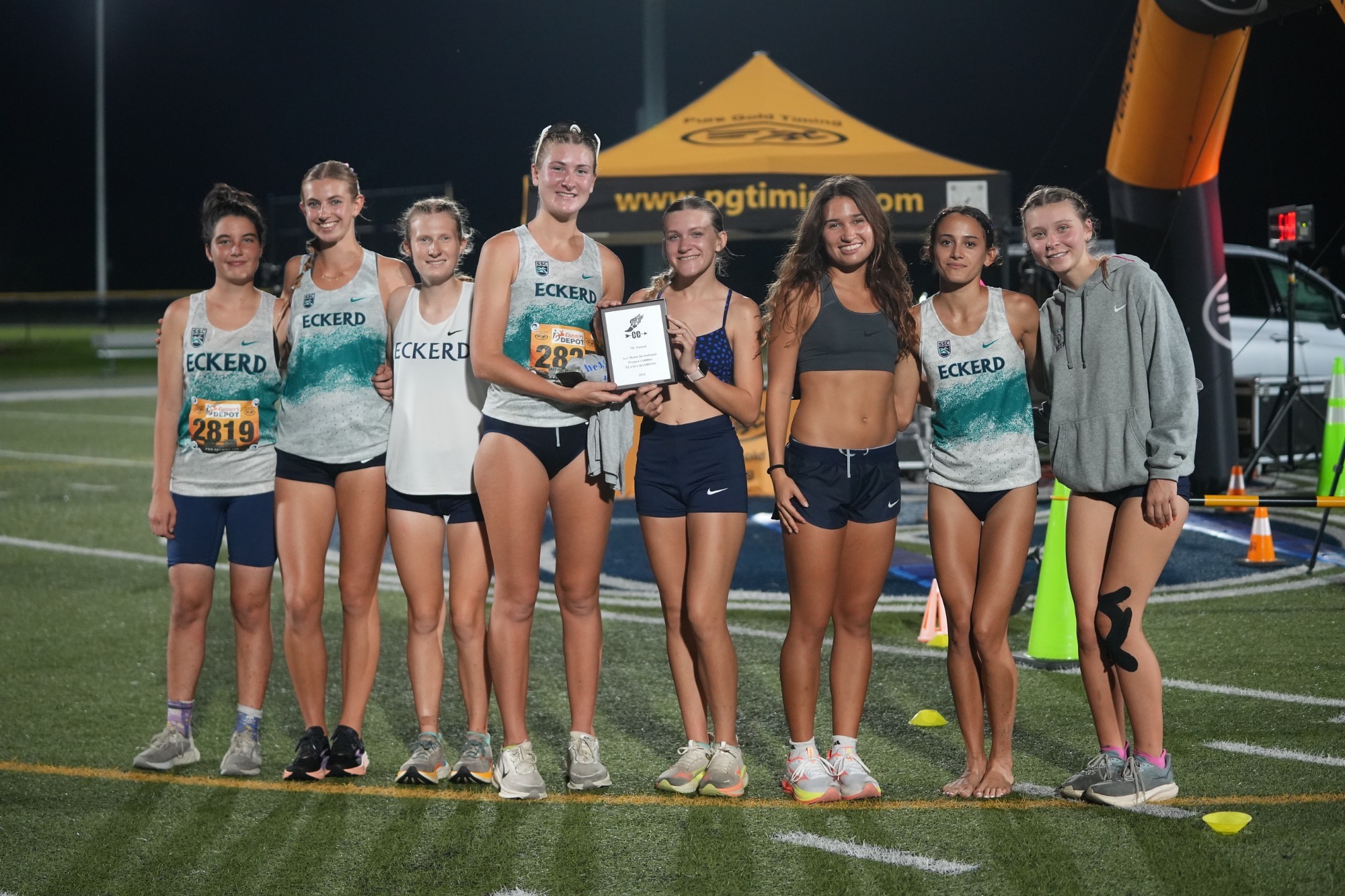 team poses after race