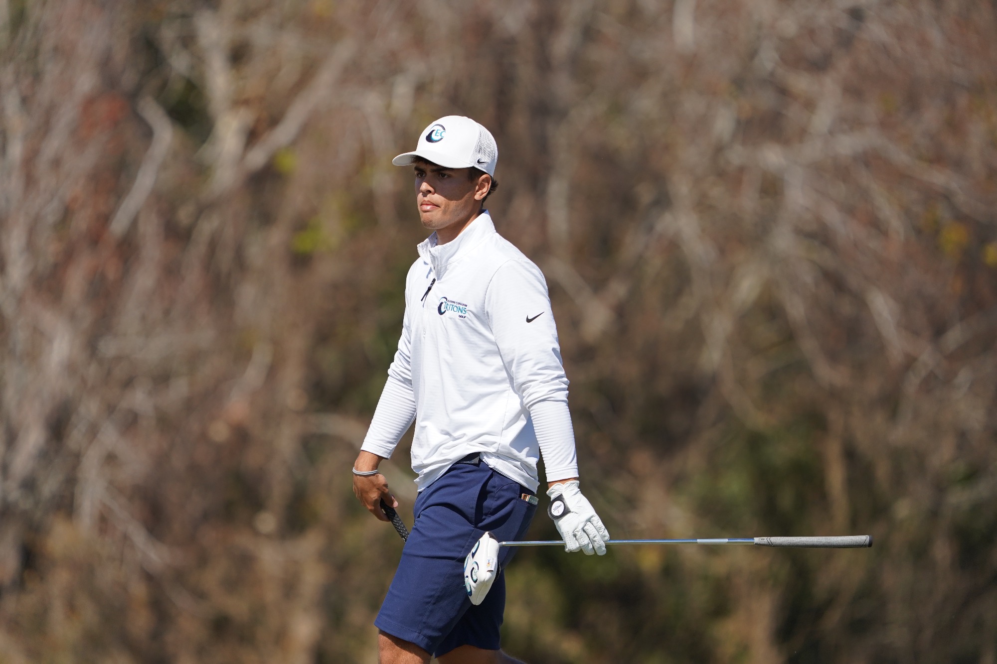 Player walking with his club