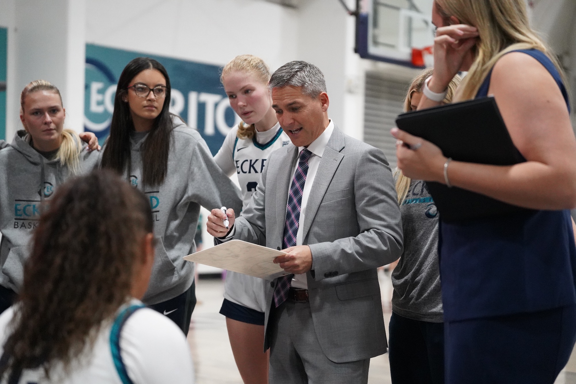Coach draws up a play during timeout