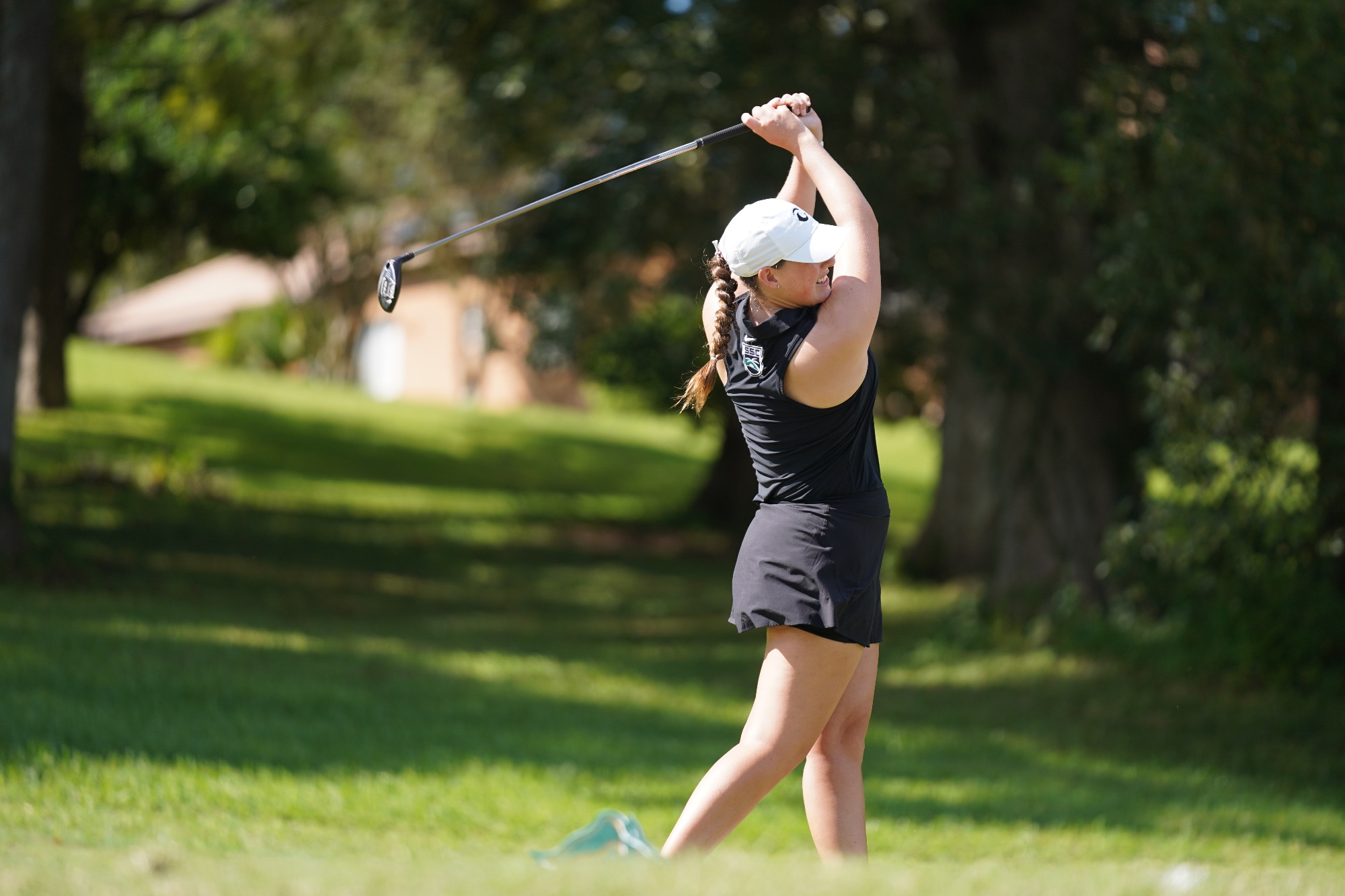 Player swings golf club