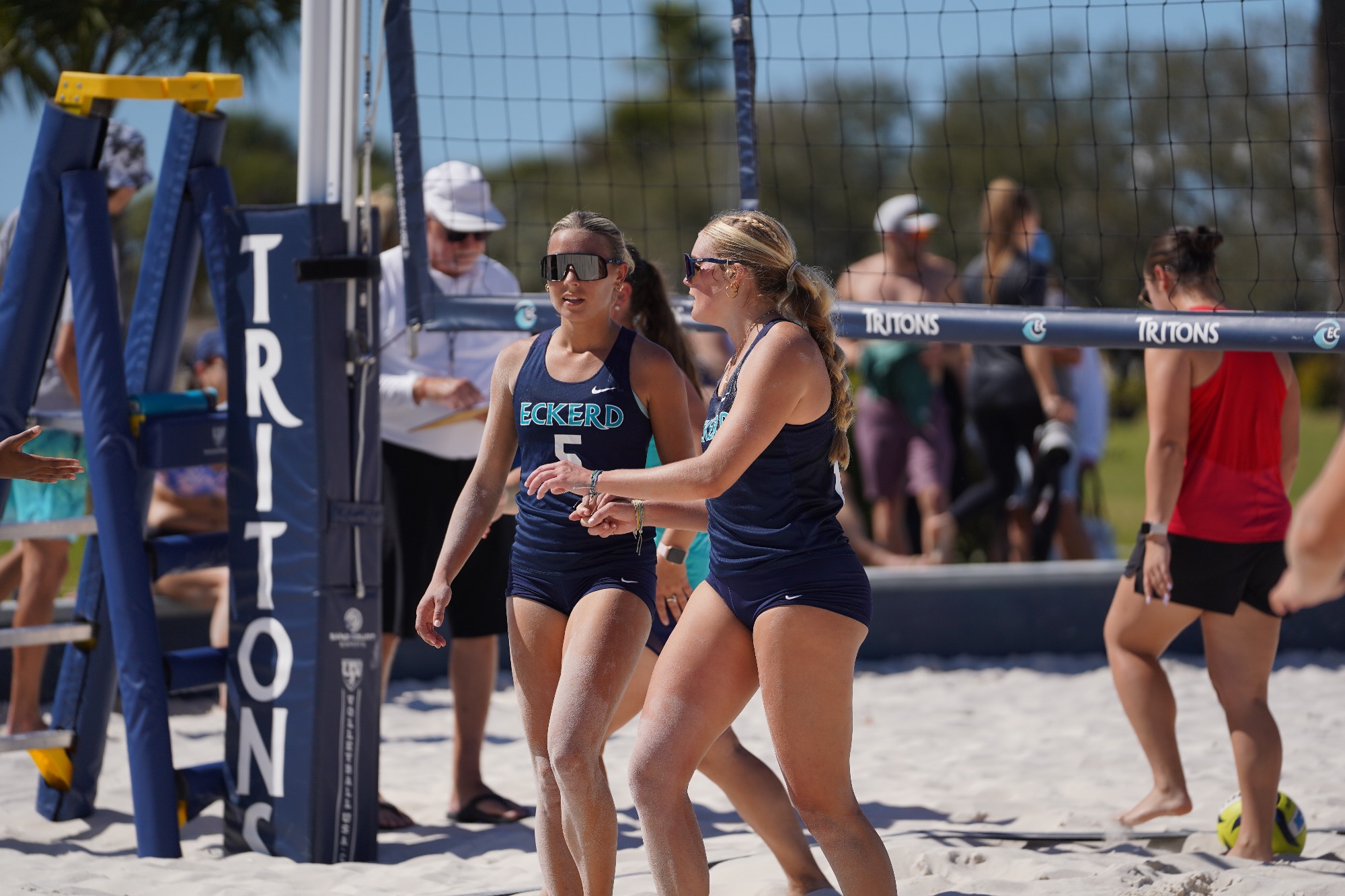 Two teammates talk after a play