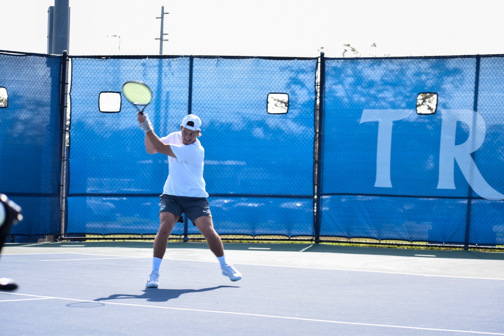 Player backhanding ball