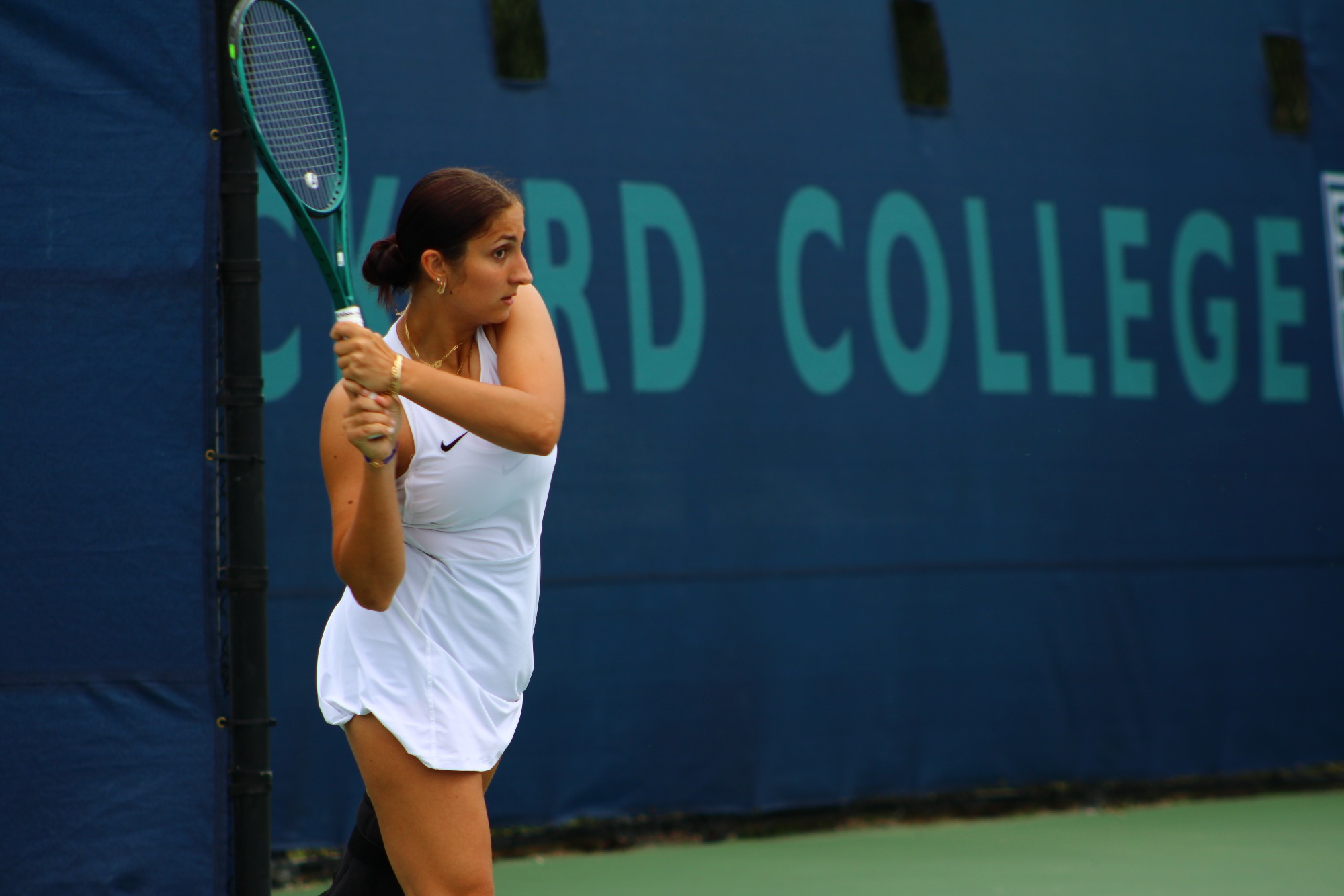 Player backhands ball