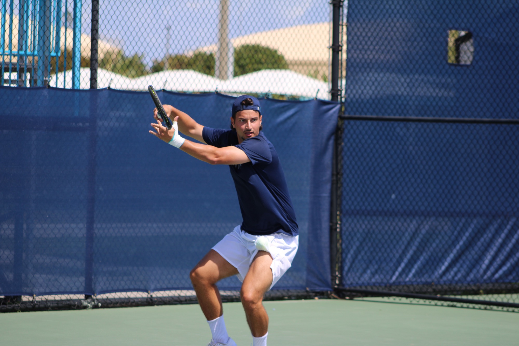 Player swings racket