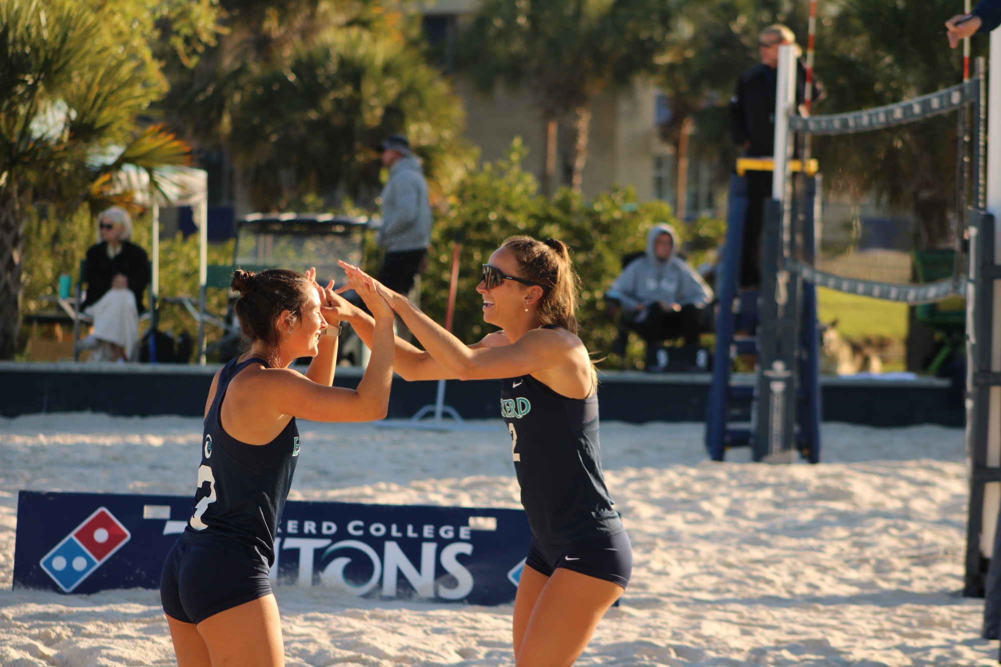 players high five after point