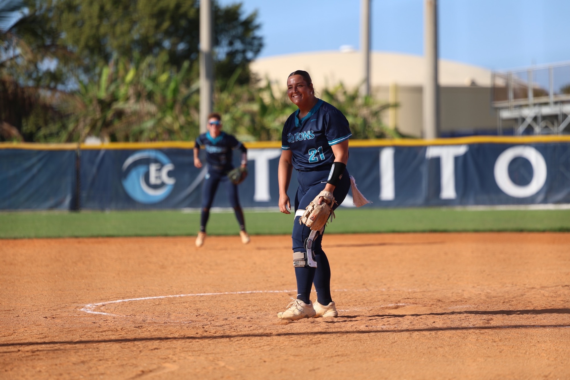 Pitcher smiles after play