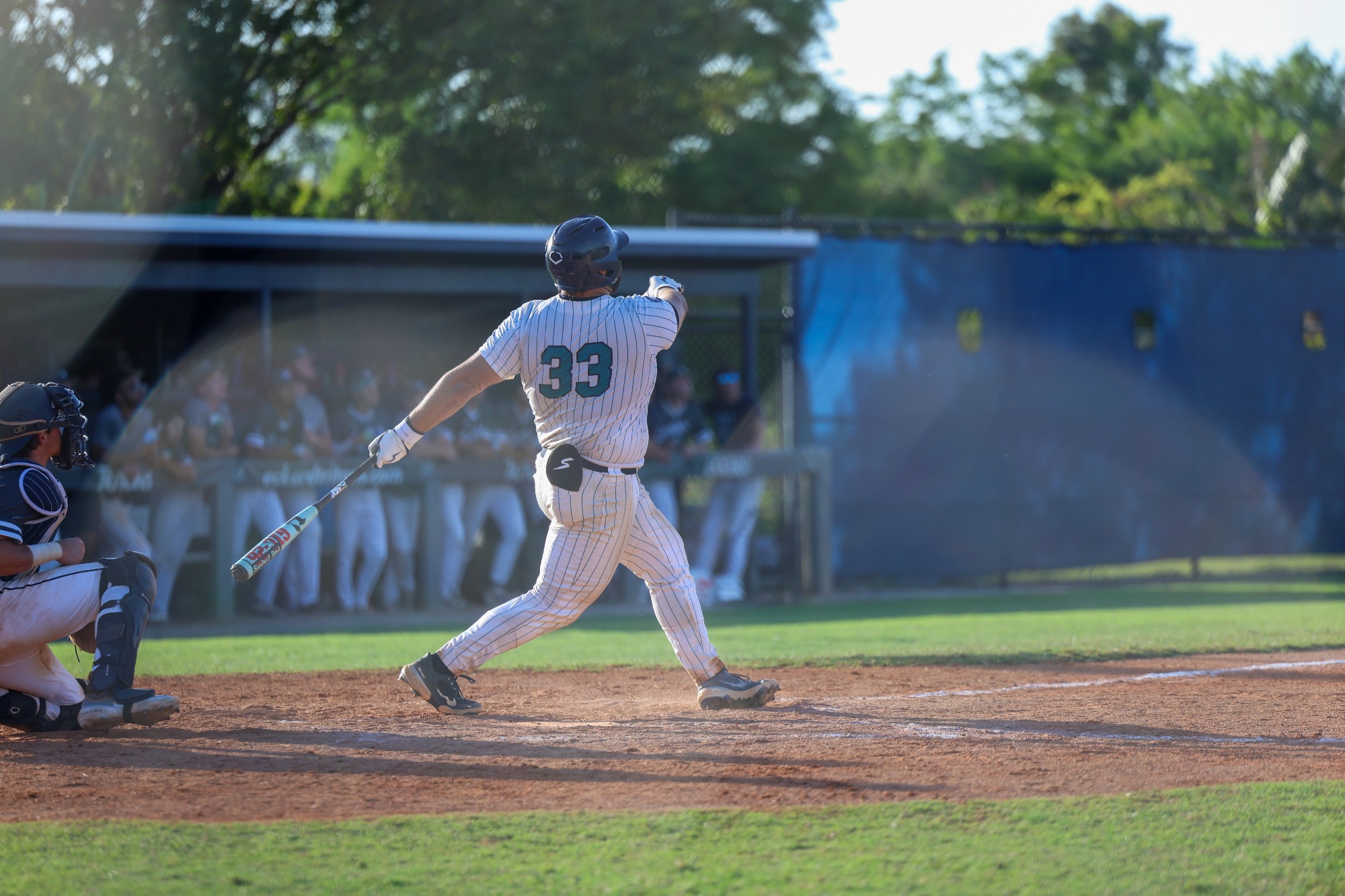 Player swings bat