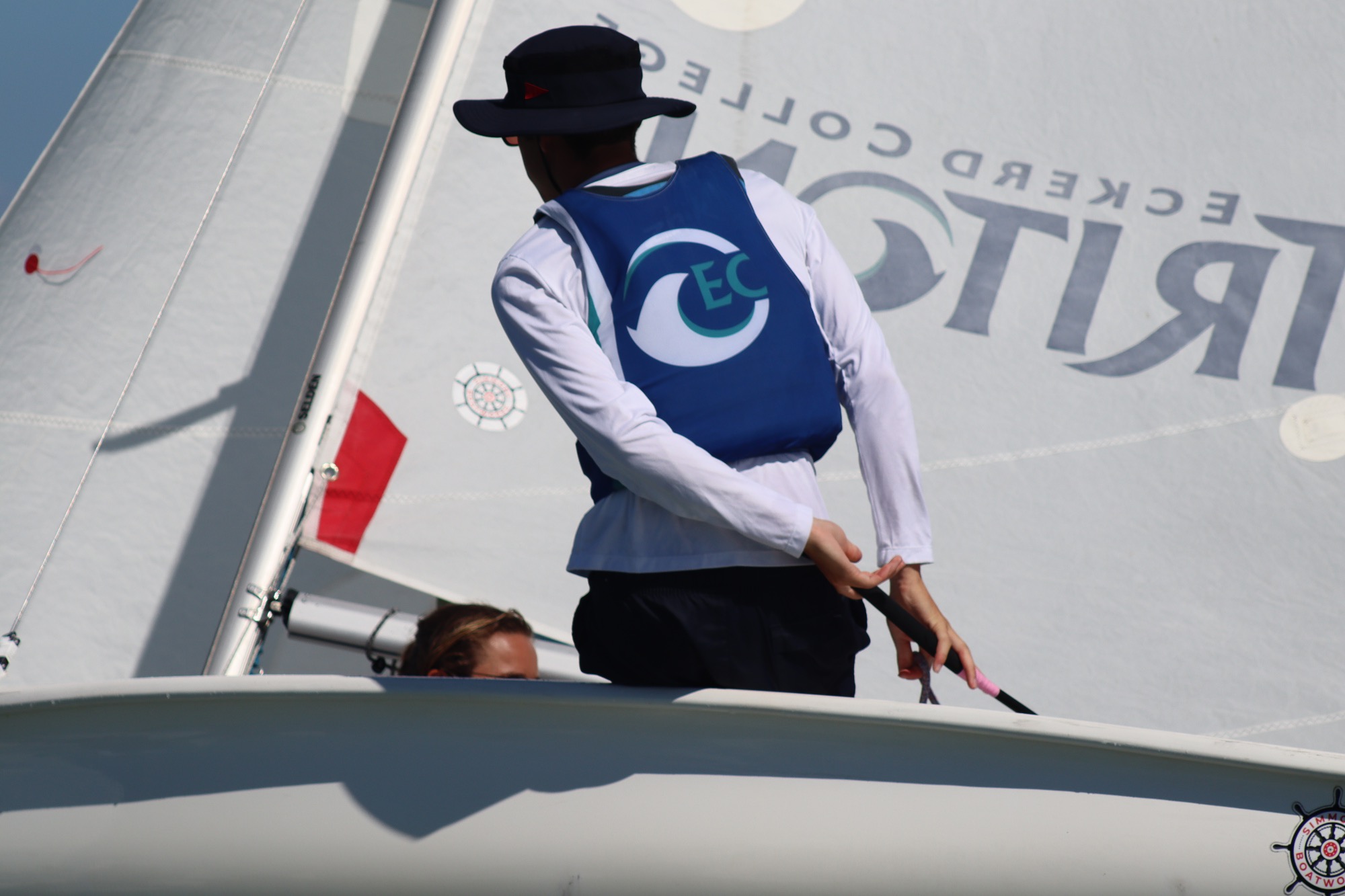 sailor stands in boat
