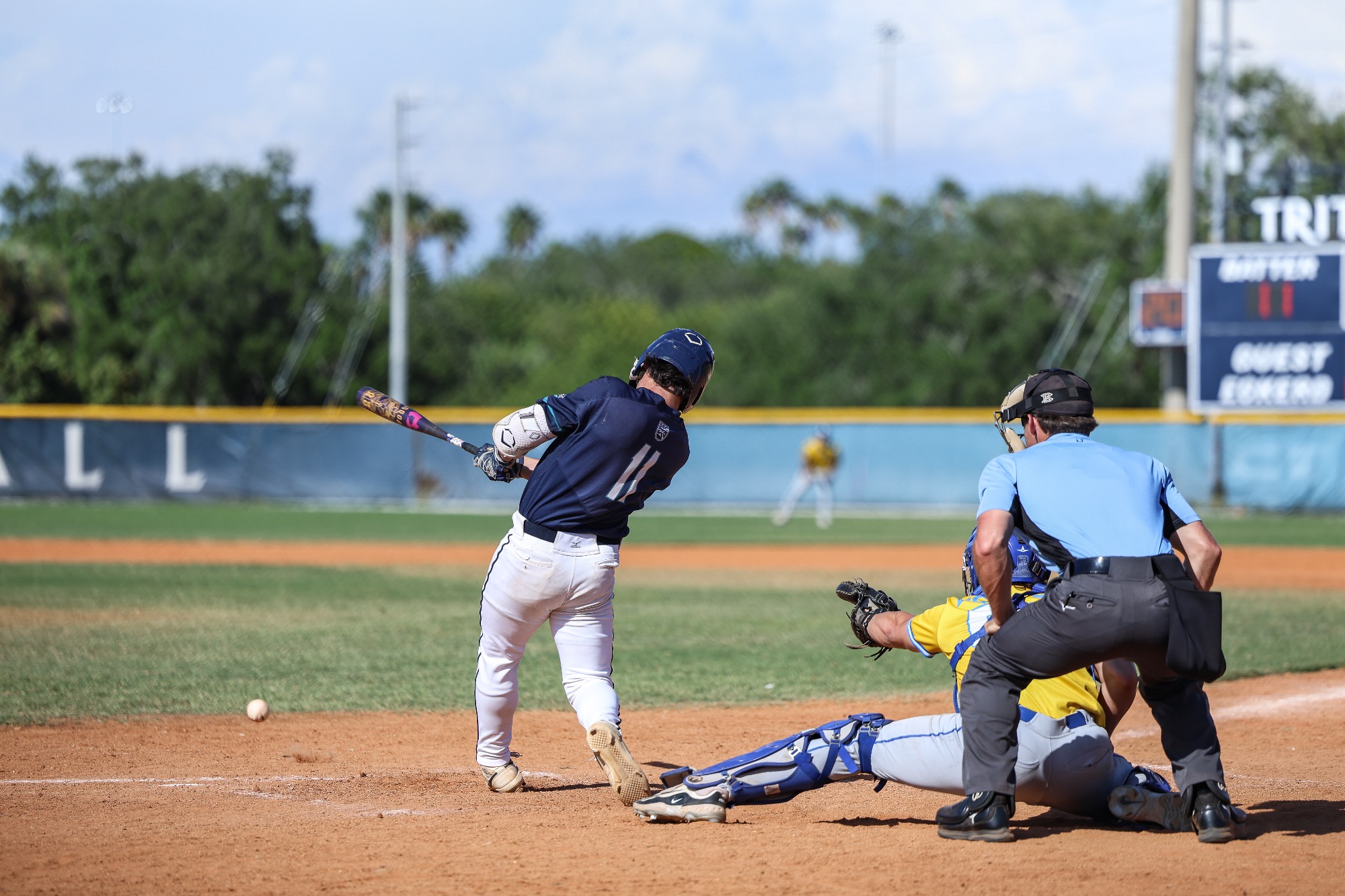 player swings bat