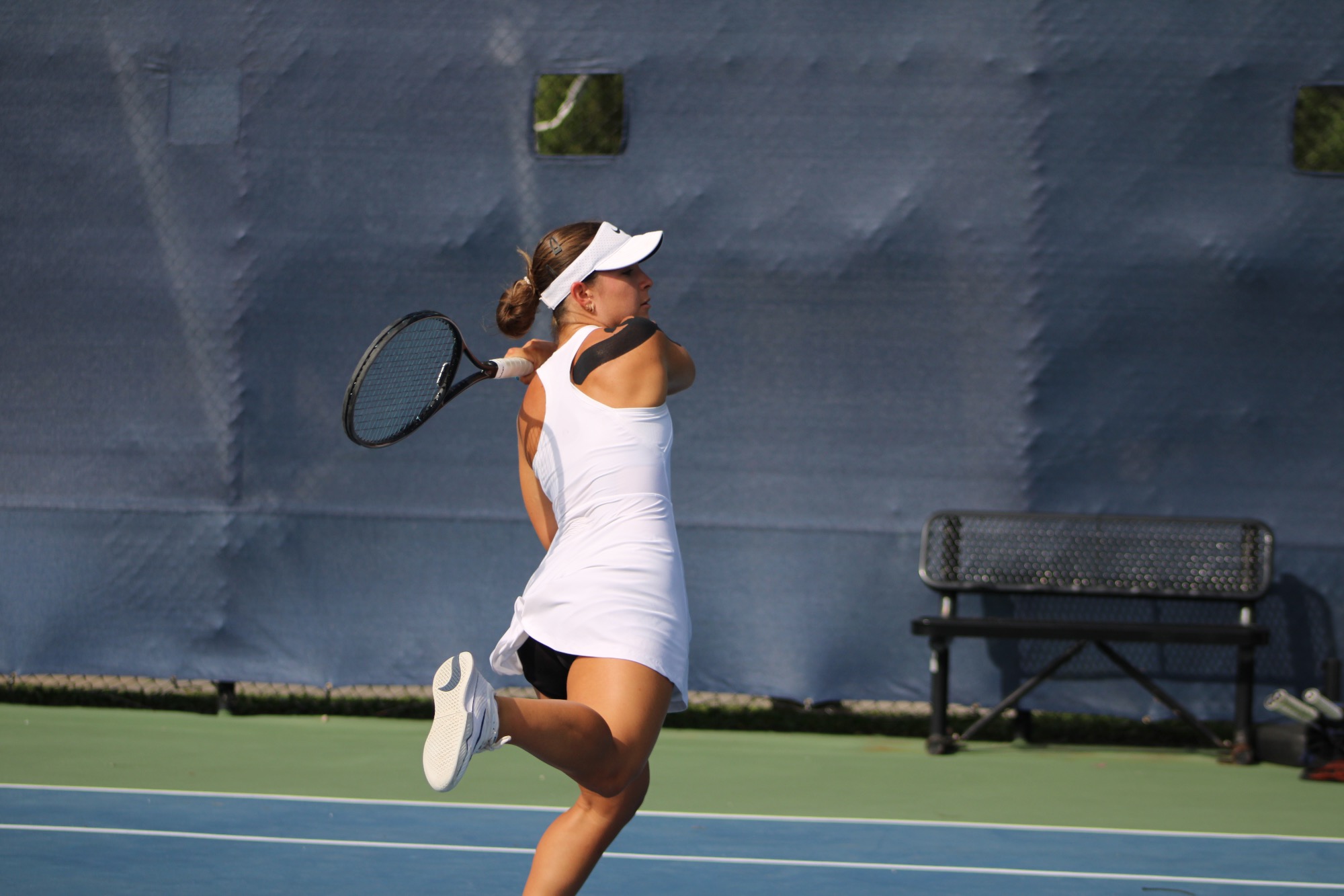 Player swings racket