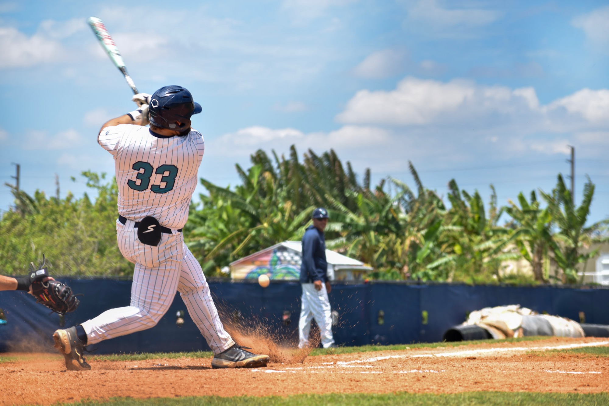 player swings bat