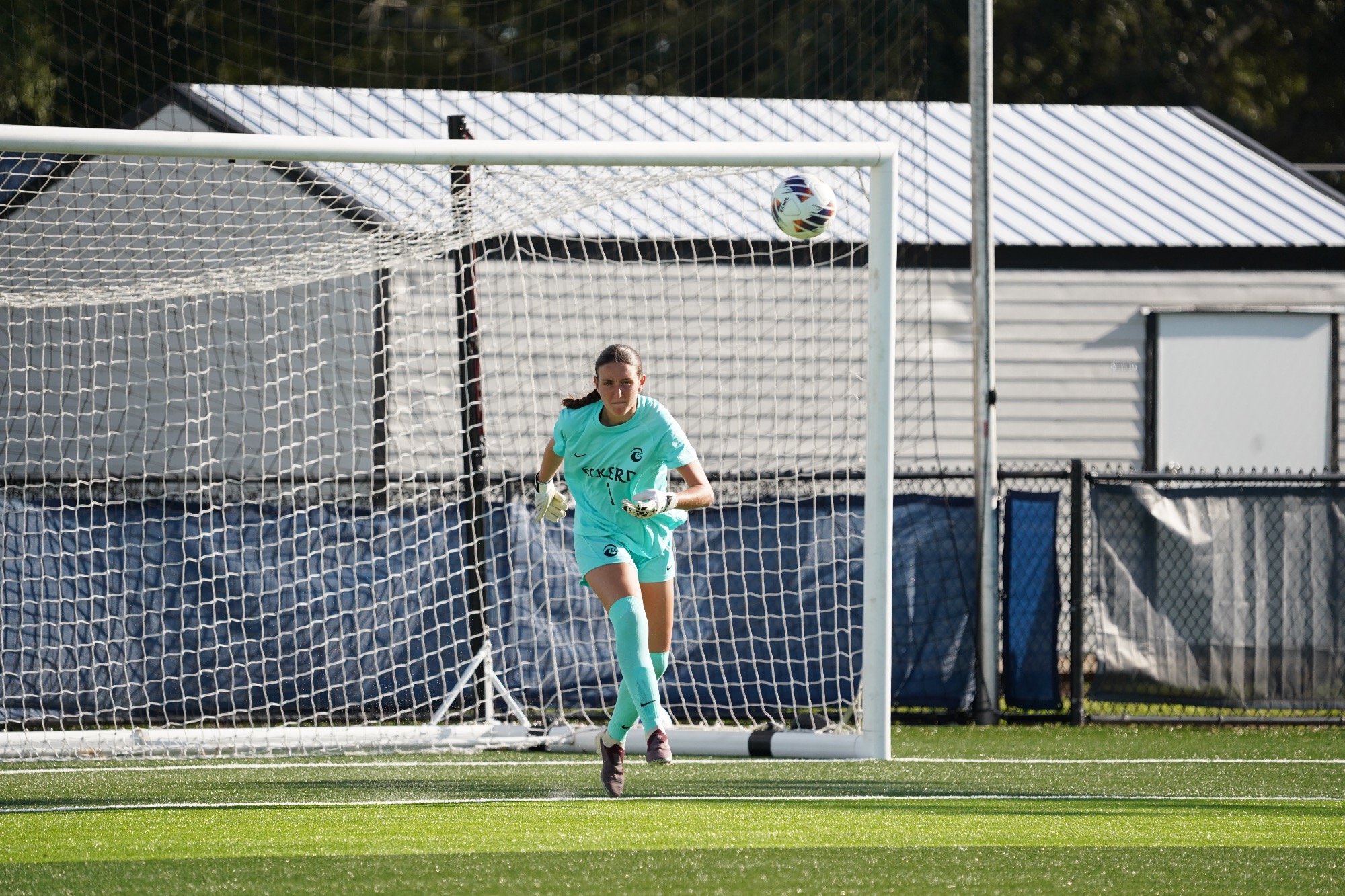 goalie kicks ball away