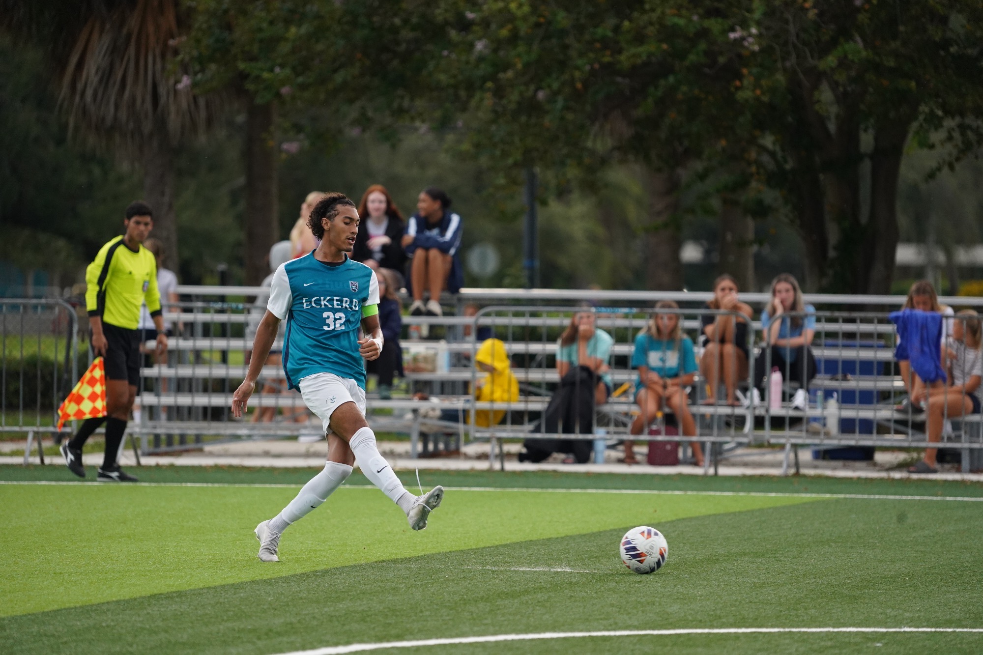 player kicks ball