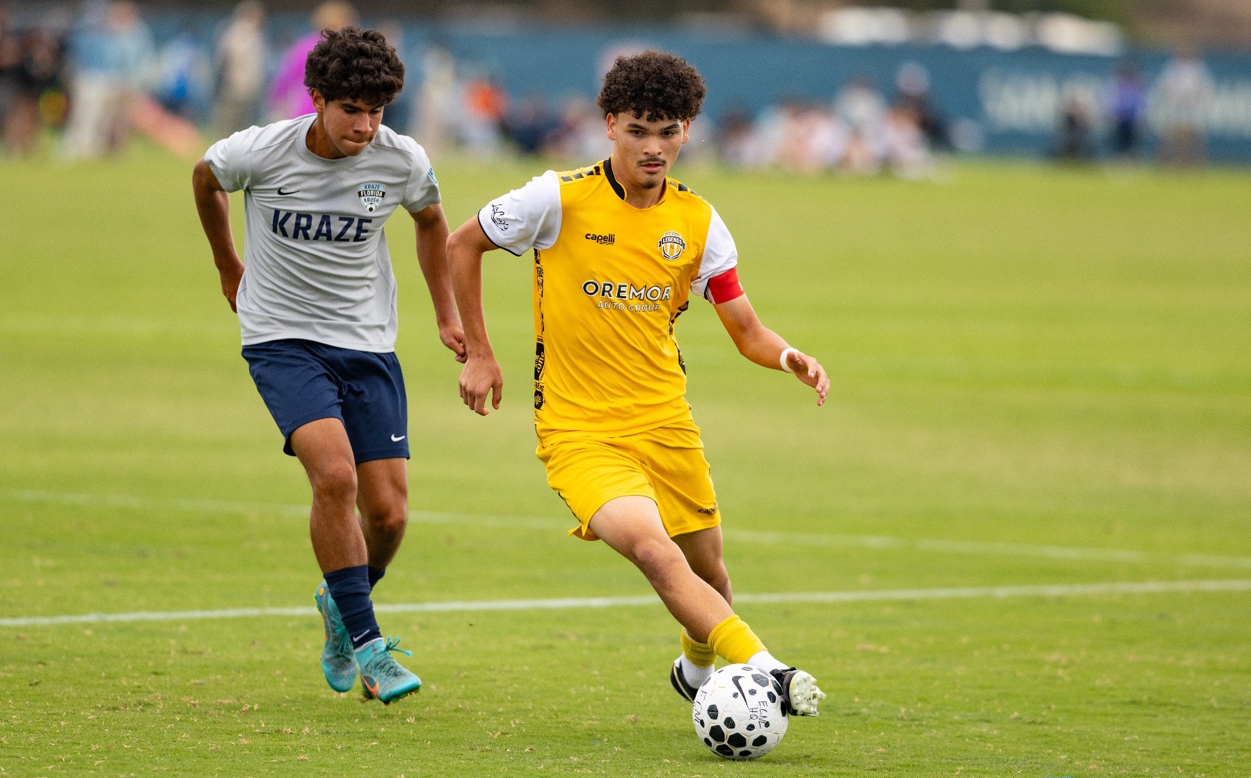 Legends FC and Florida Kraze Krush go for a 50-50 ball at the ECNL Boys National Playoffs in San Diego