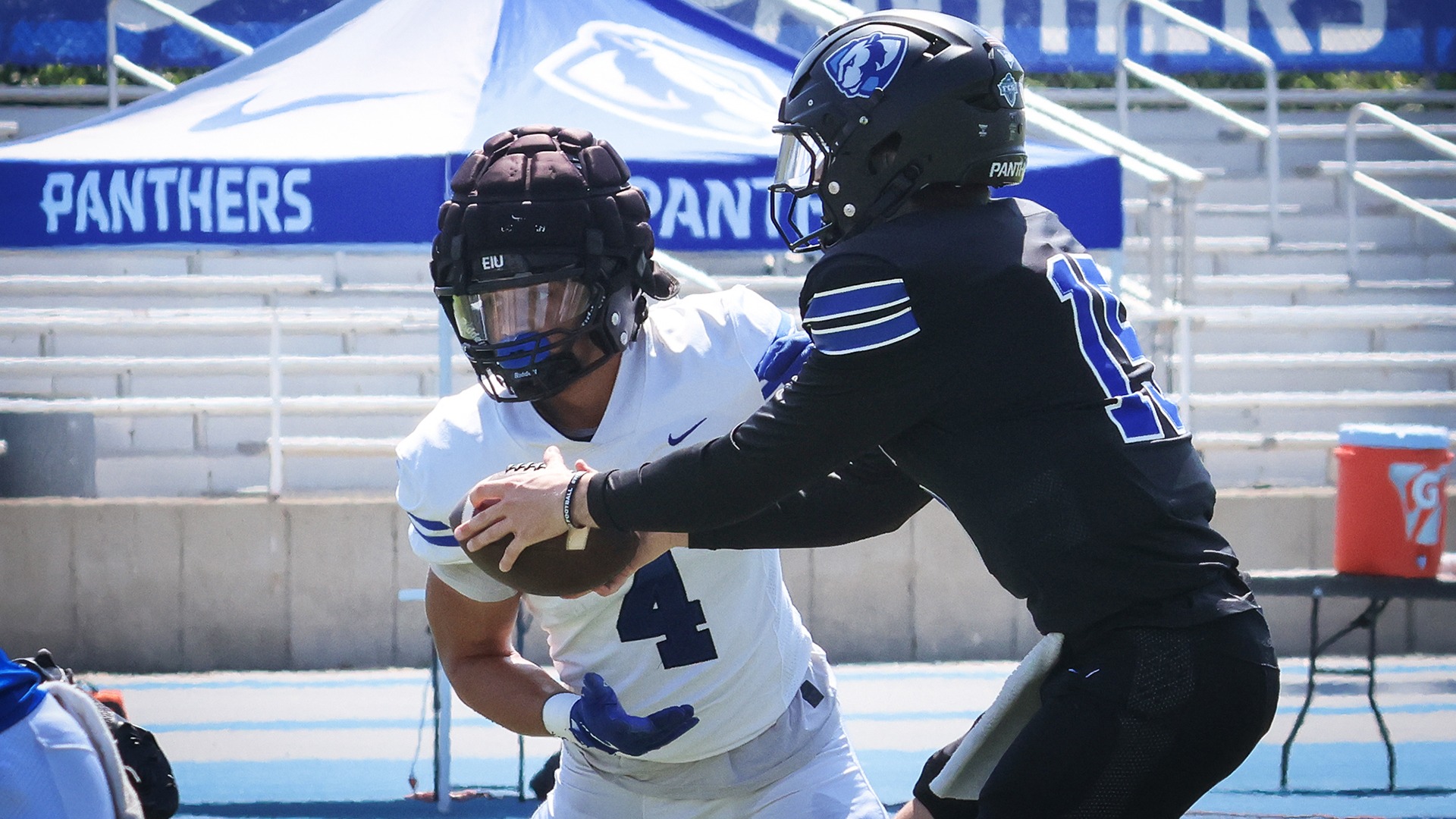 EIU Football Fall Camp Report No. 1 - running back Charles Kellom takes the handoff