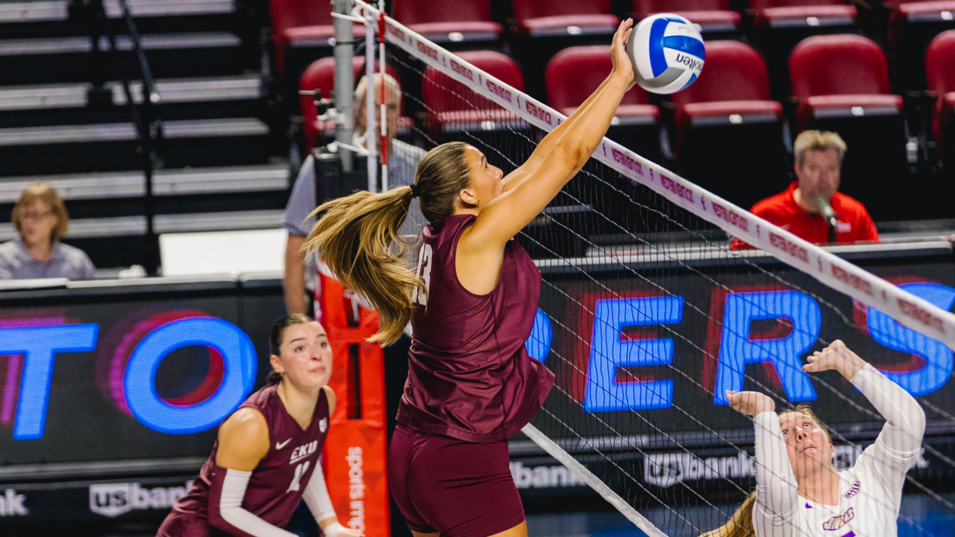 Alexis Bull blocks an attack against James Madison