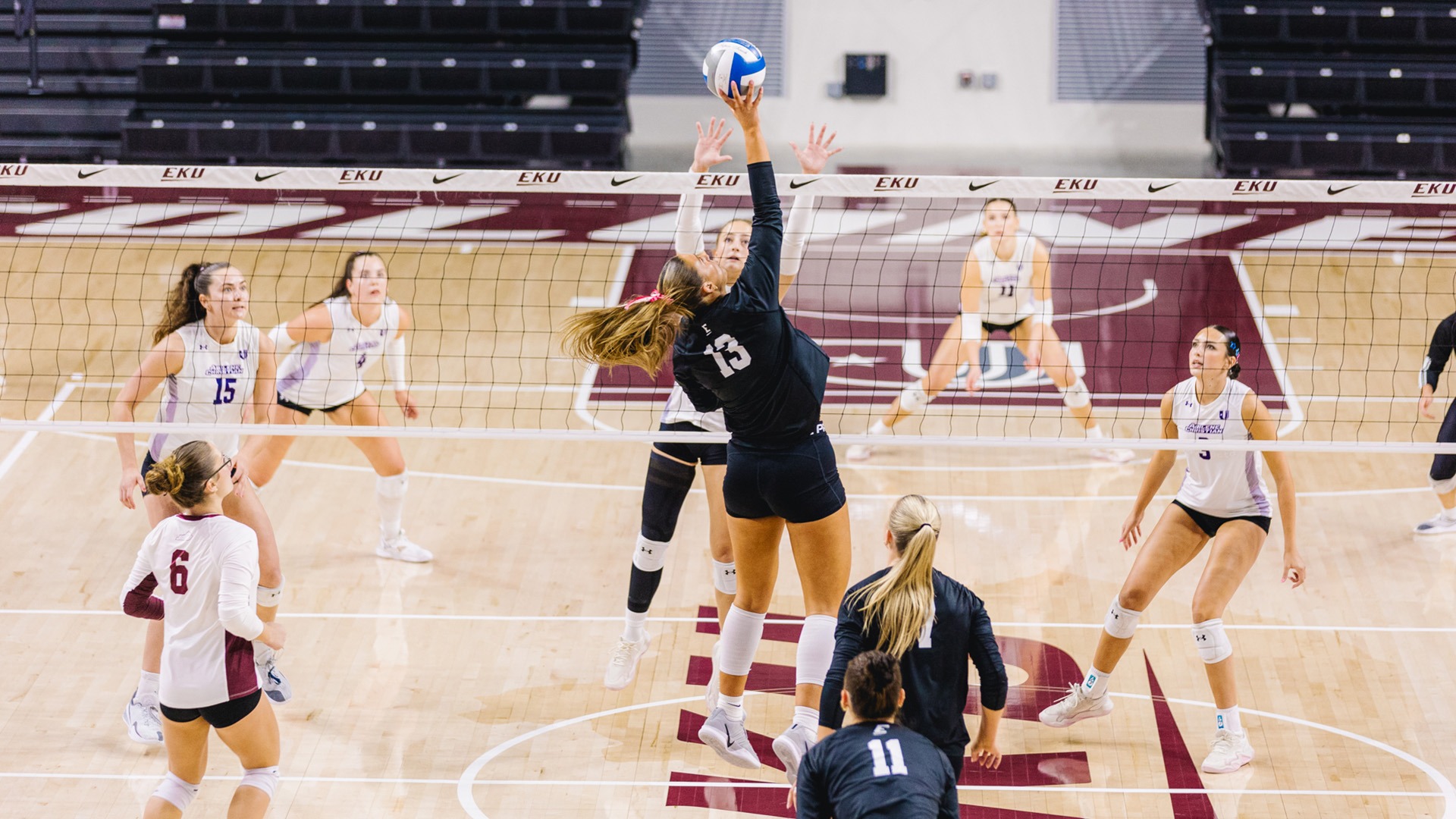 Alexis Bull attacks the ball in the middle against Abilene Christian