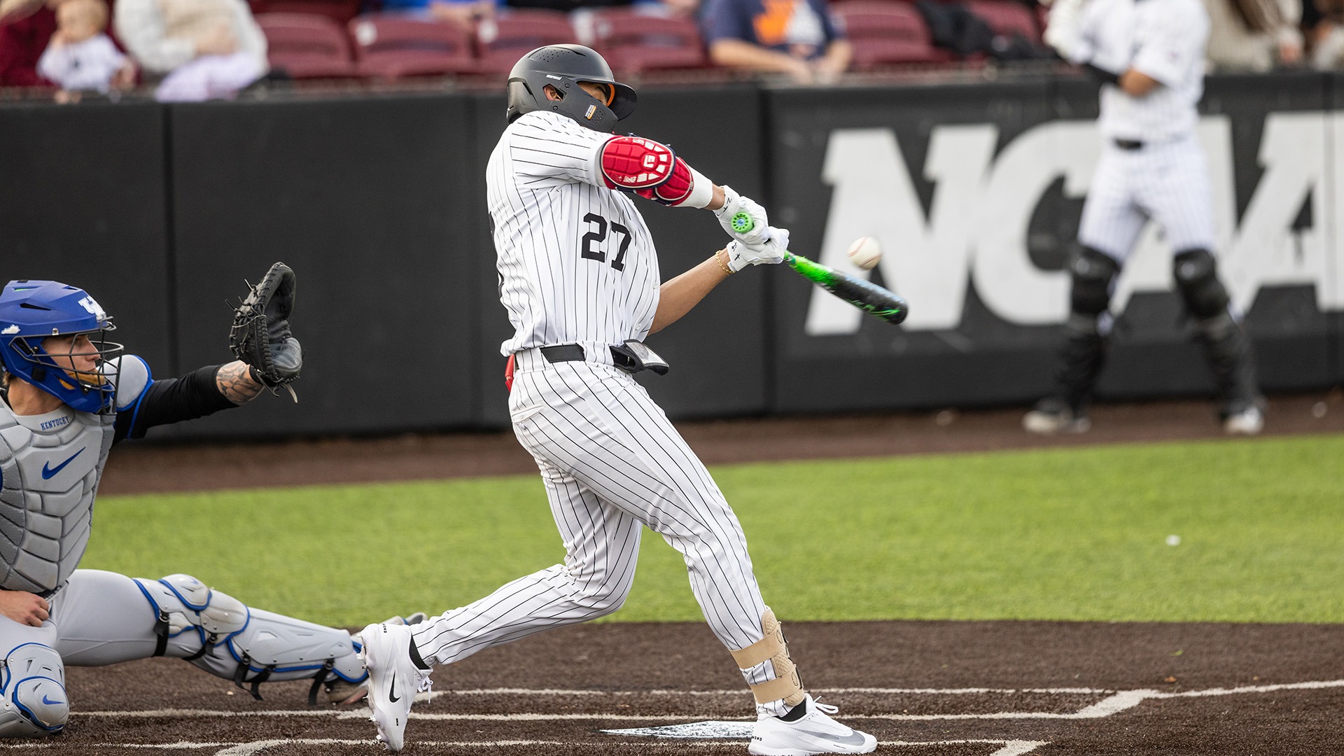 David Alvarez connects on a pitch against Kentucky