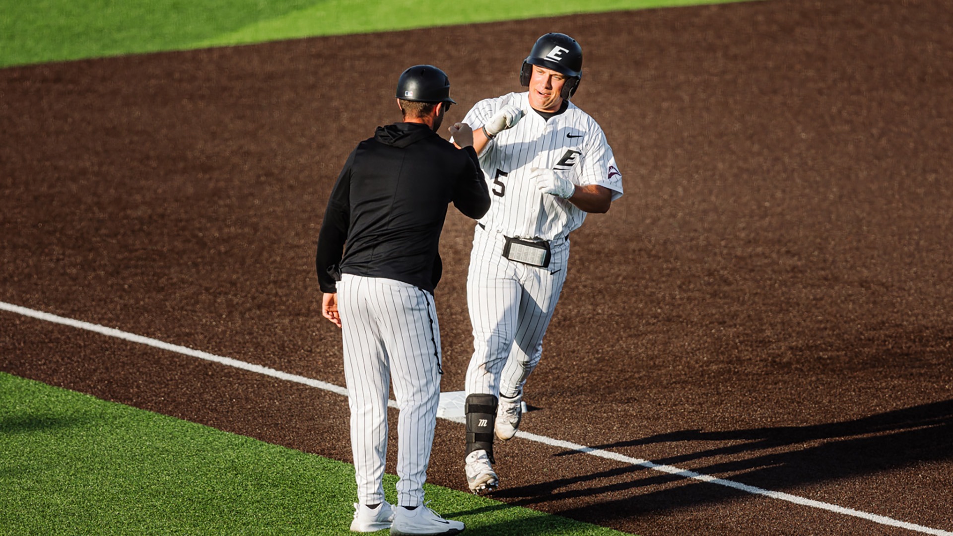 Ryan Johnson rounds third base after hitting a home run against Kentucky State