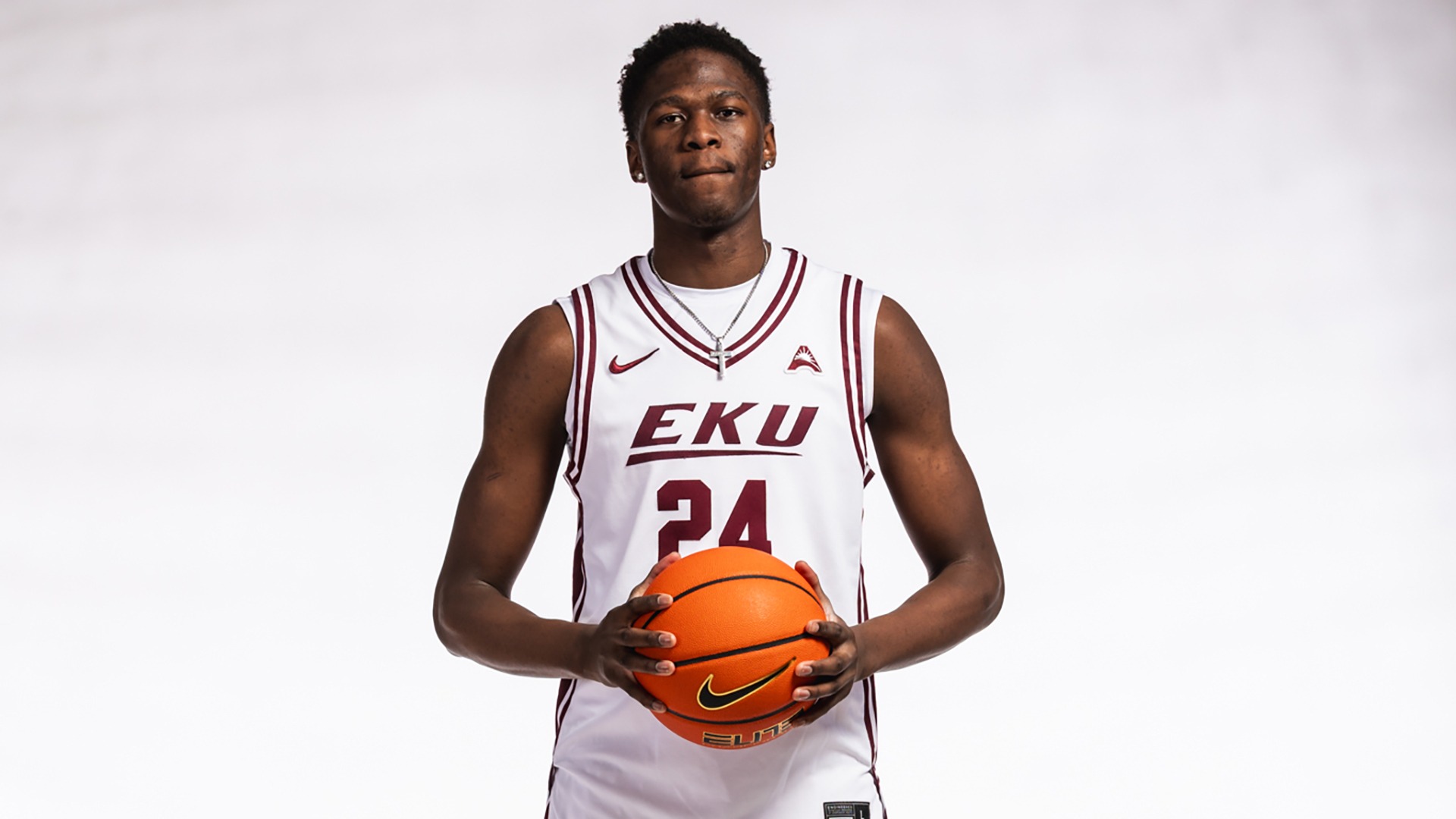 Shadrak Lasu poses with a basketball in his hands