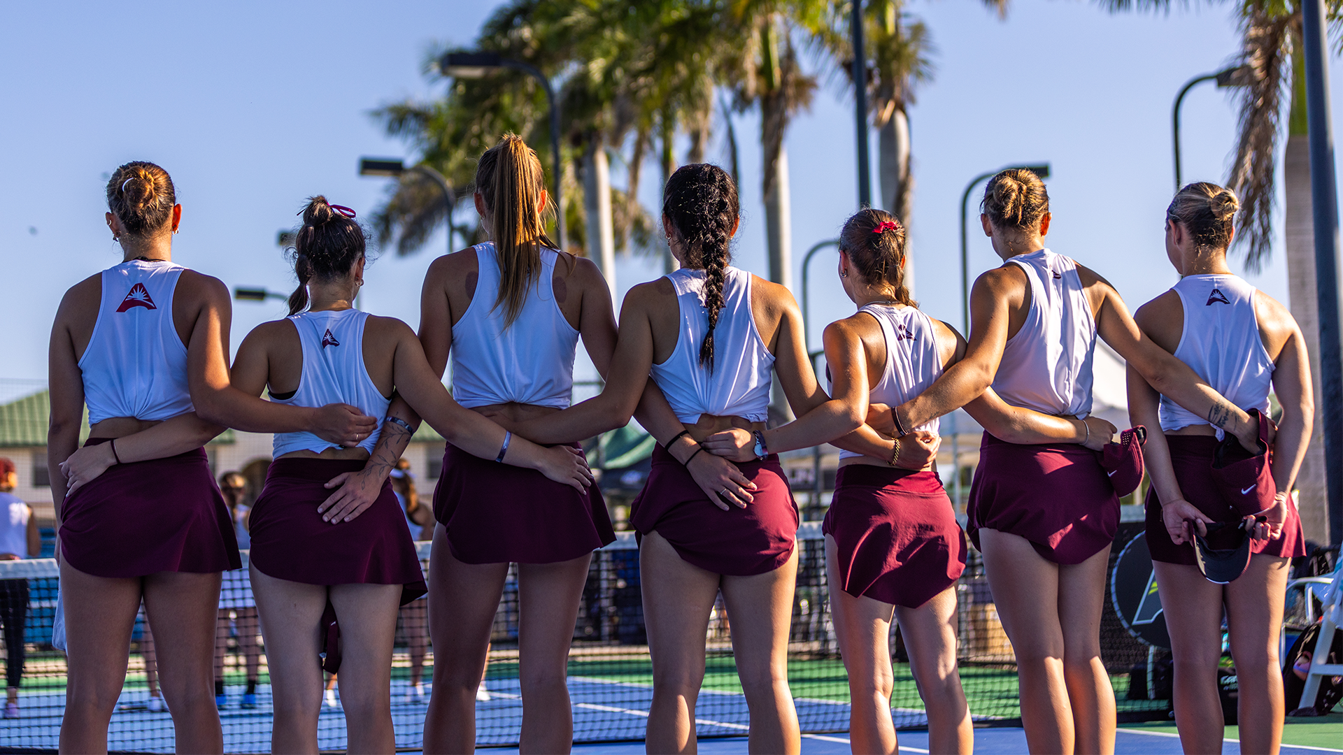 EKU Women's Tennis Team at ASUN Tournament, standing at attention
