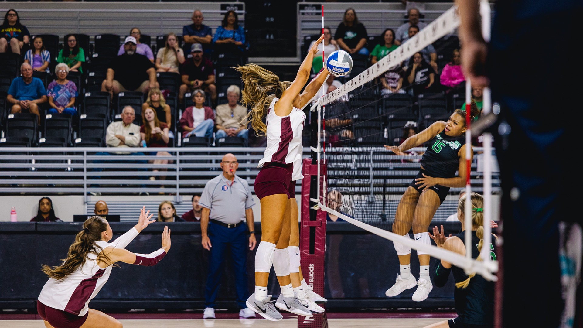 Two Colonels go up at the net to block an attack from Marshall