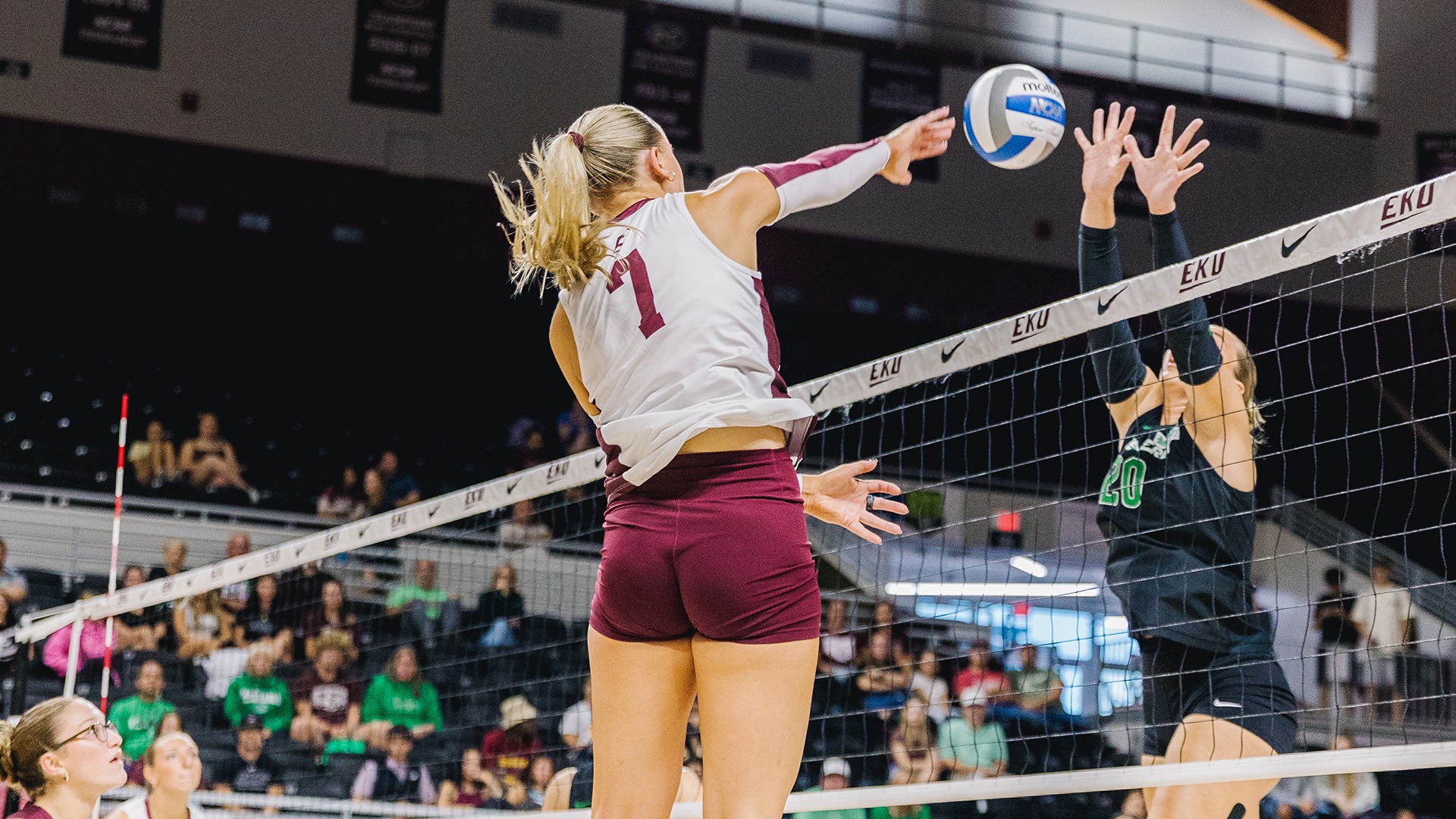 Emilee Hill attacks the ball against Marshall