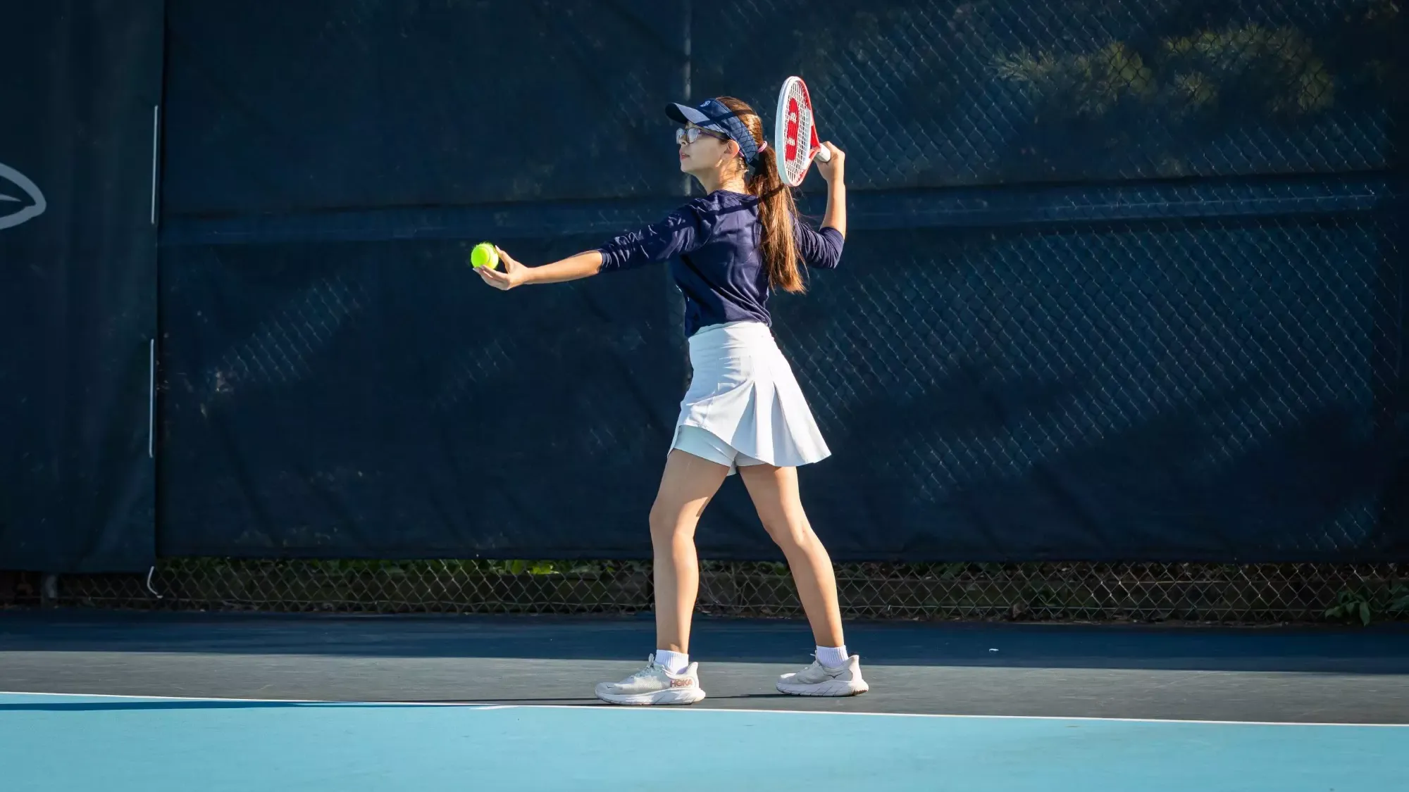 Annelise Alvarenga during the Elmhurst University Women's Tennis match against Roosevelt University on 10/9/2024. Photo by Matthew Haufe/Elmhurst Athletics.