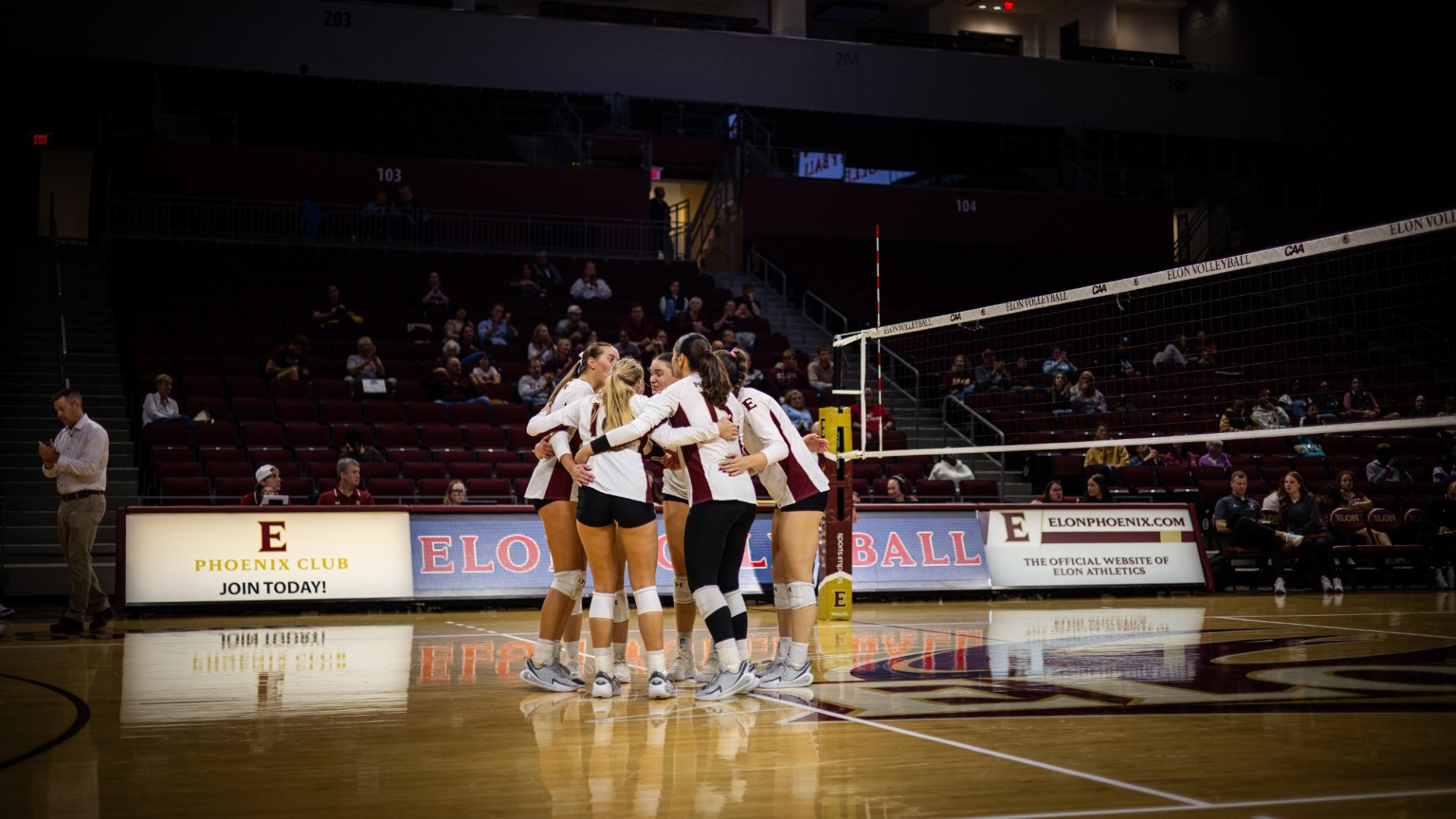 Elon Volleyball huddle versus Northeastern