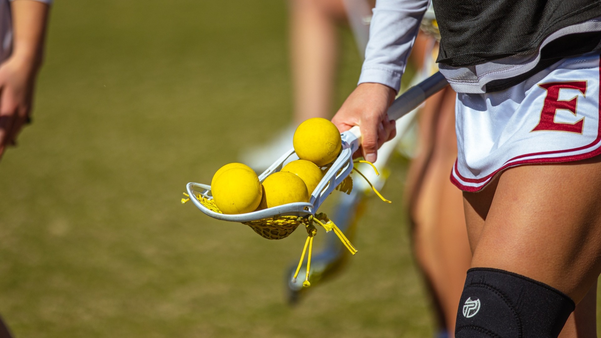 Stock shot of lacrosse stick with balls