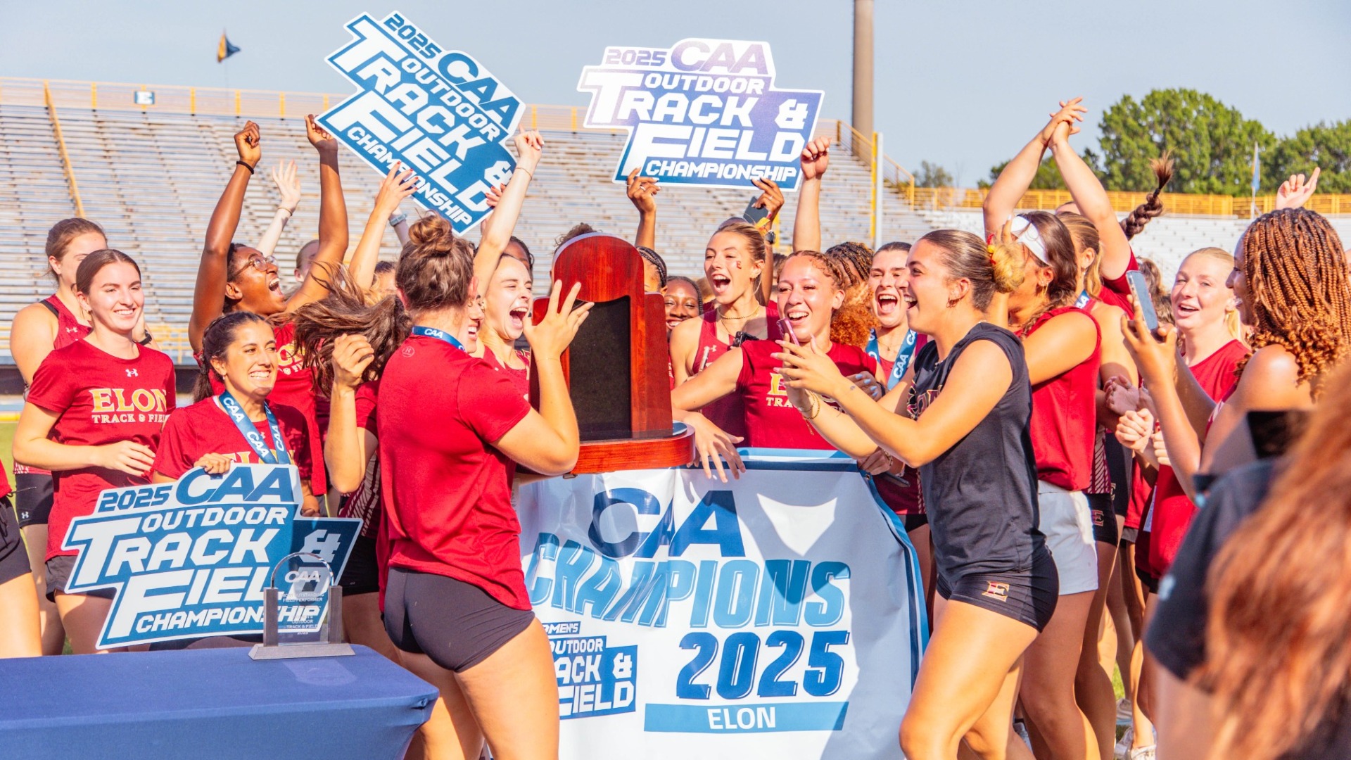 Elon women's track & field celebrating at CAA Outdoor Championships