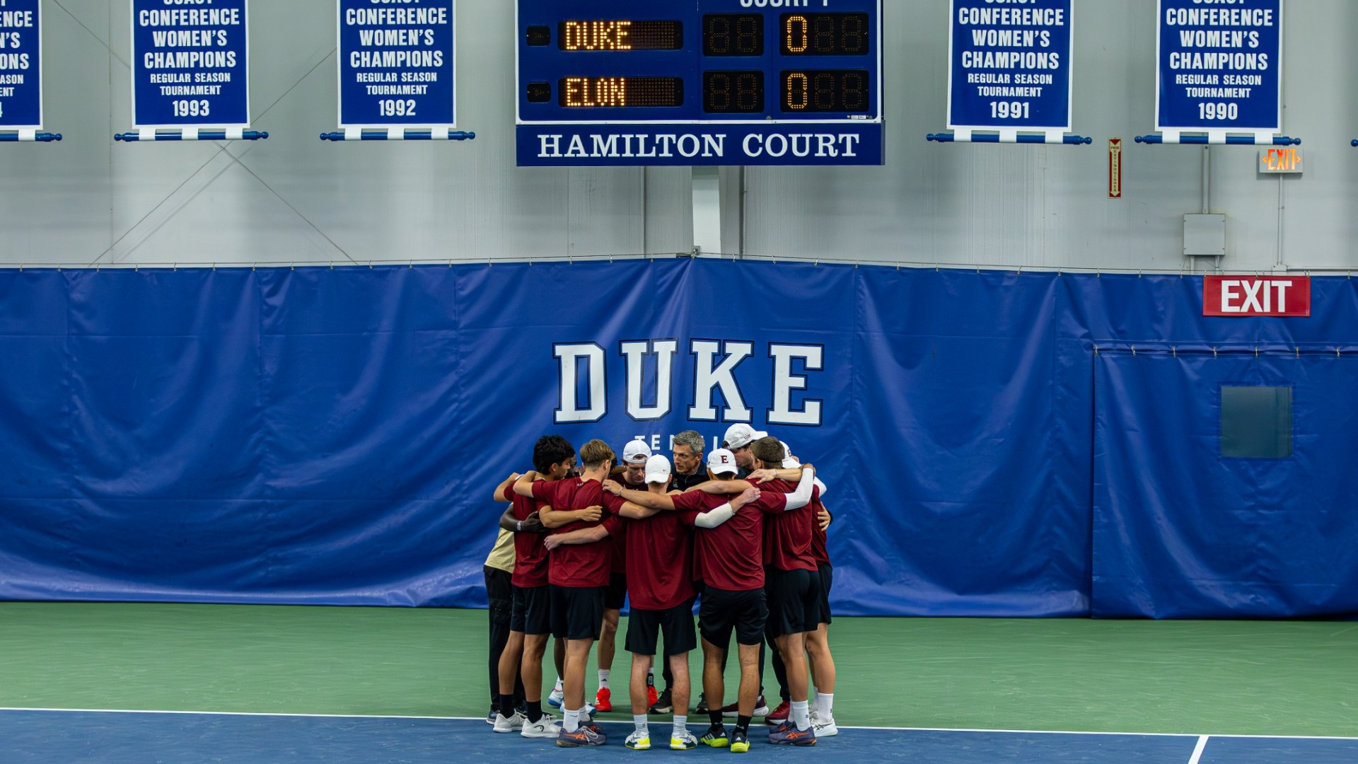 Elon men's tennis huddle at Duke