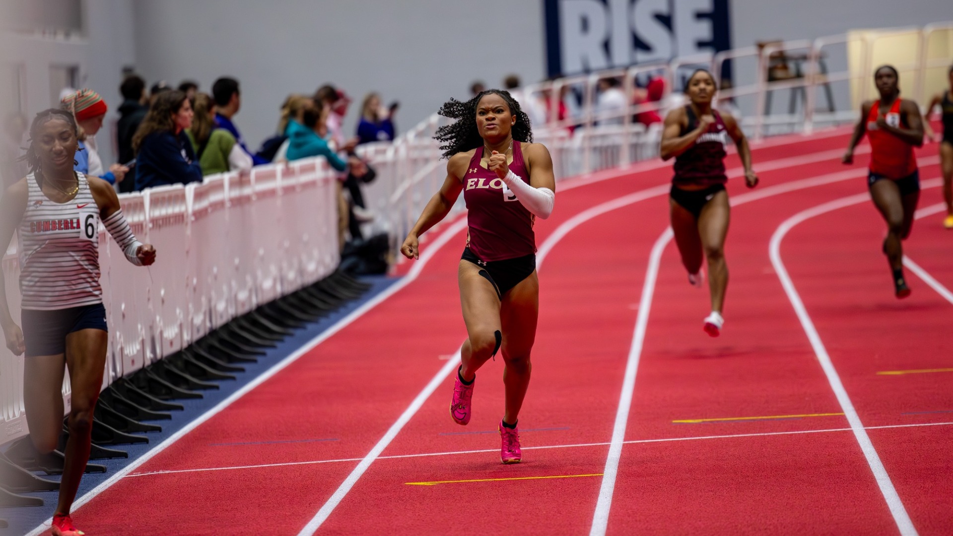 Teri Pridgen running across the finish line at the Liberty Kickoff