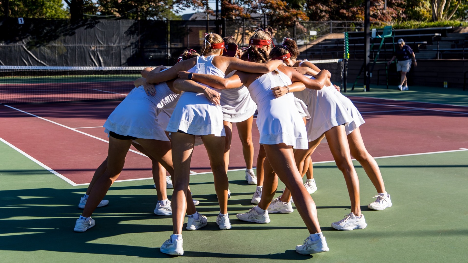 Women's Tennis huddle at Jimmy Powell Invitational 