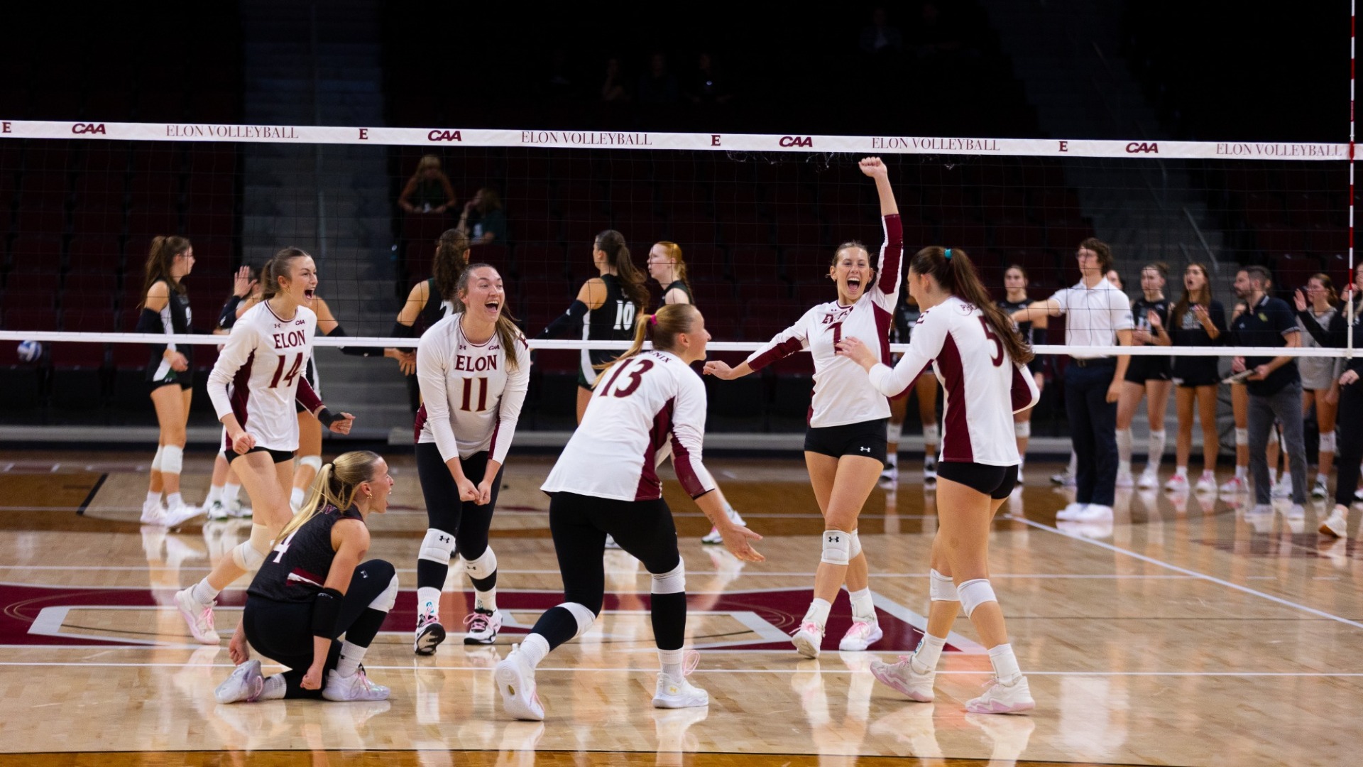 Elon Volleyball celebrates versus William & Mary on Oct. 16