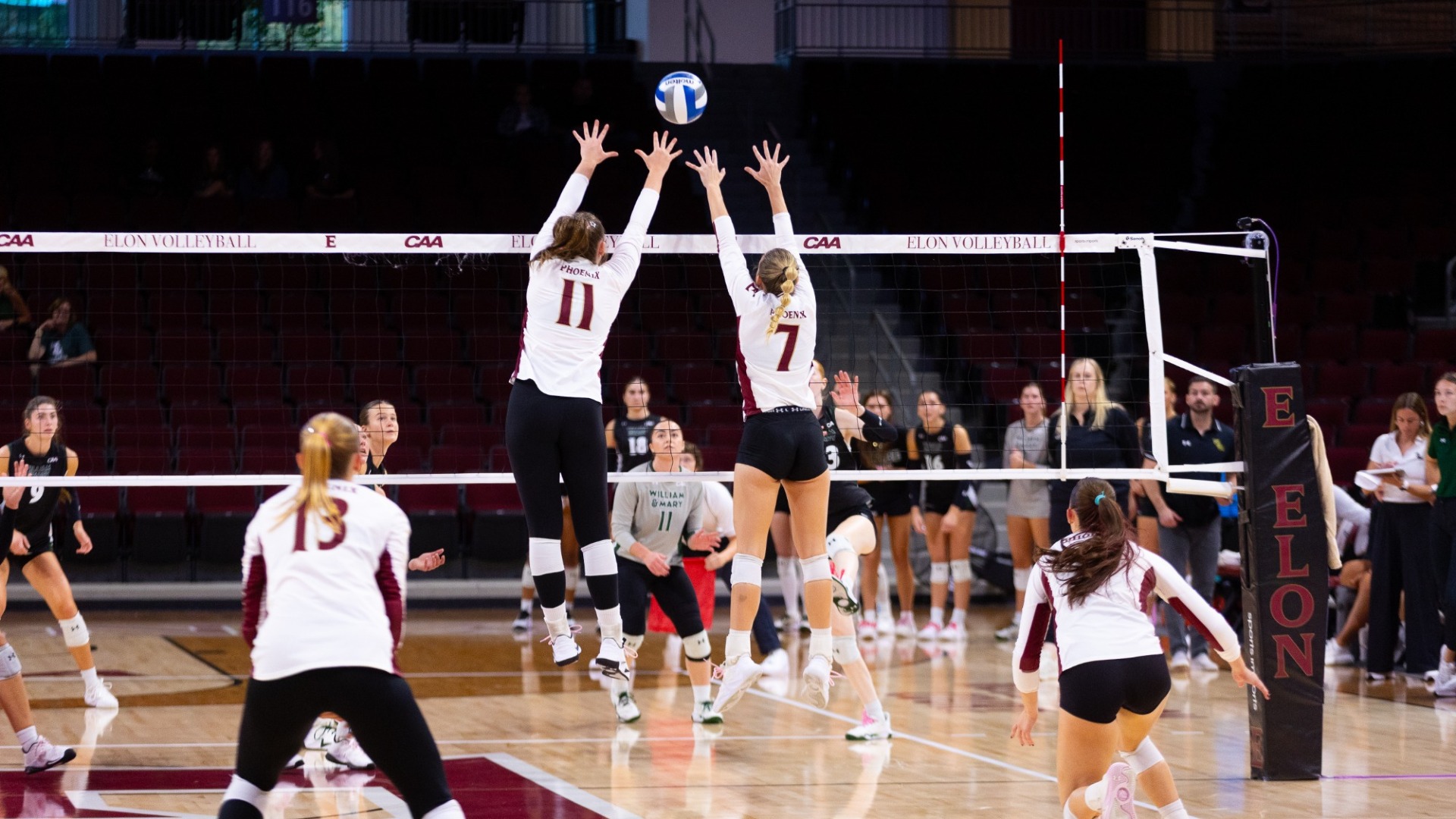 Caroline Berlekamp and April Rice goes up for a block versus William & Mary