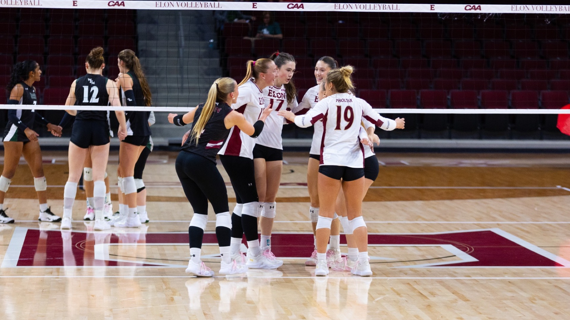 Elon Volleyball huddle versus William & Mary on Oct. 16