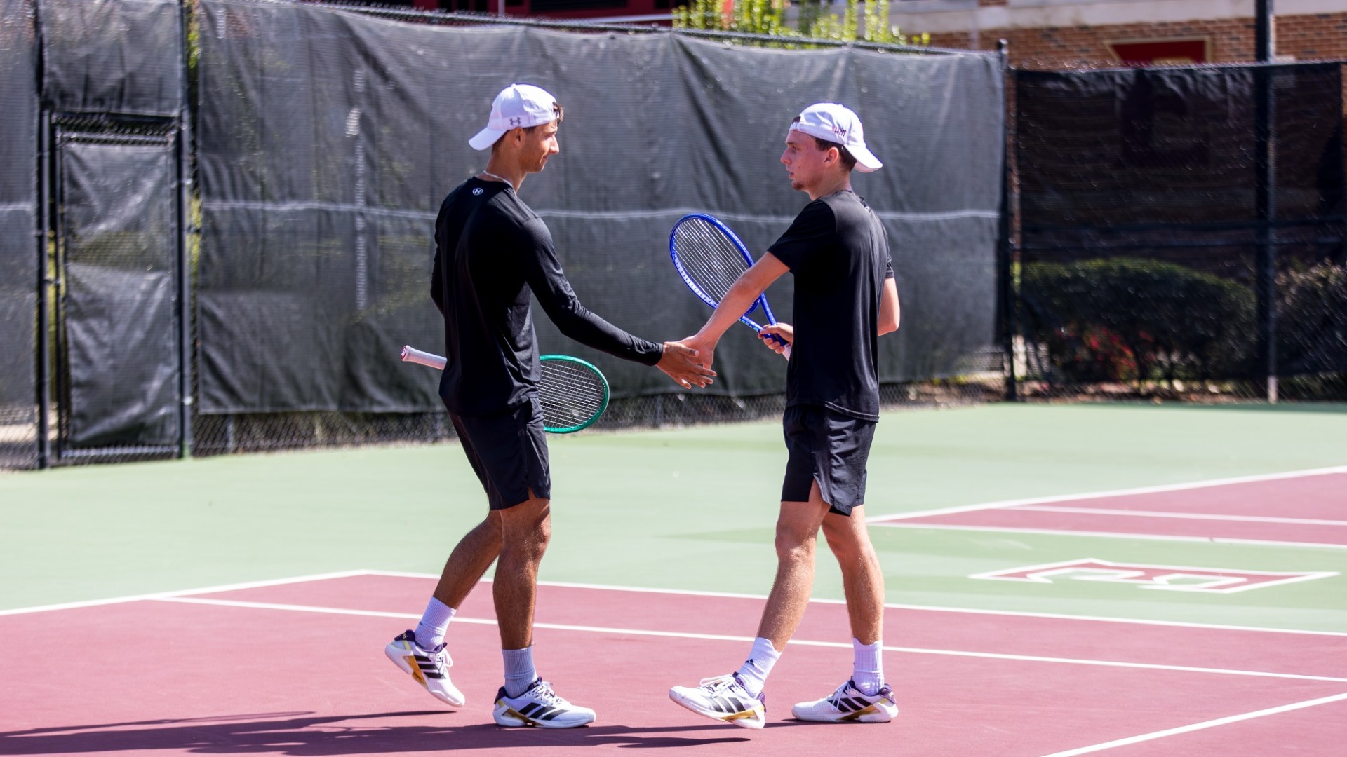Nikola Parichkov and Charles Pilet Elon Invitational high five