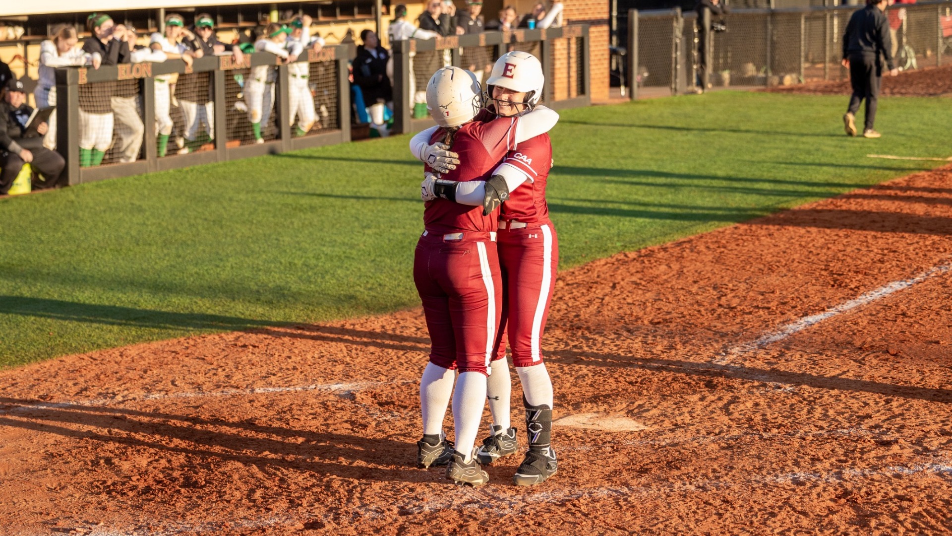 Chloe Hatzopoulos and Teagan Baulsir celebrate after a home run versus Manhattan